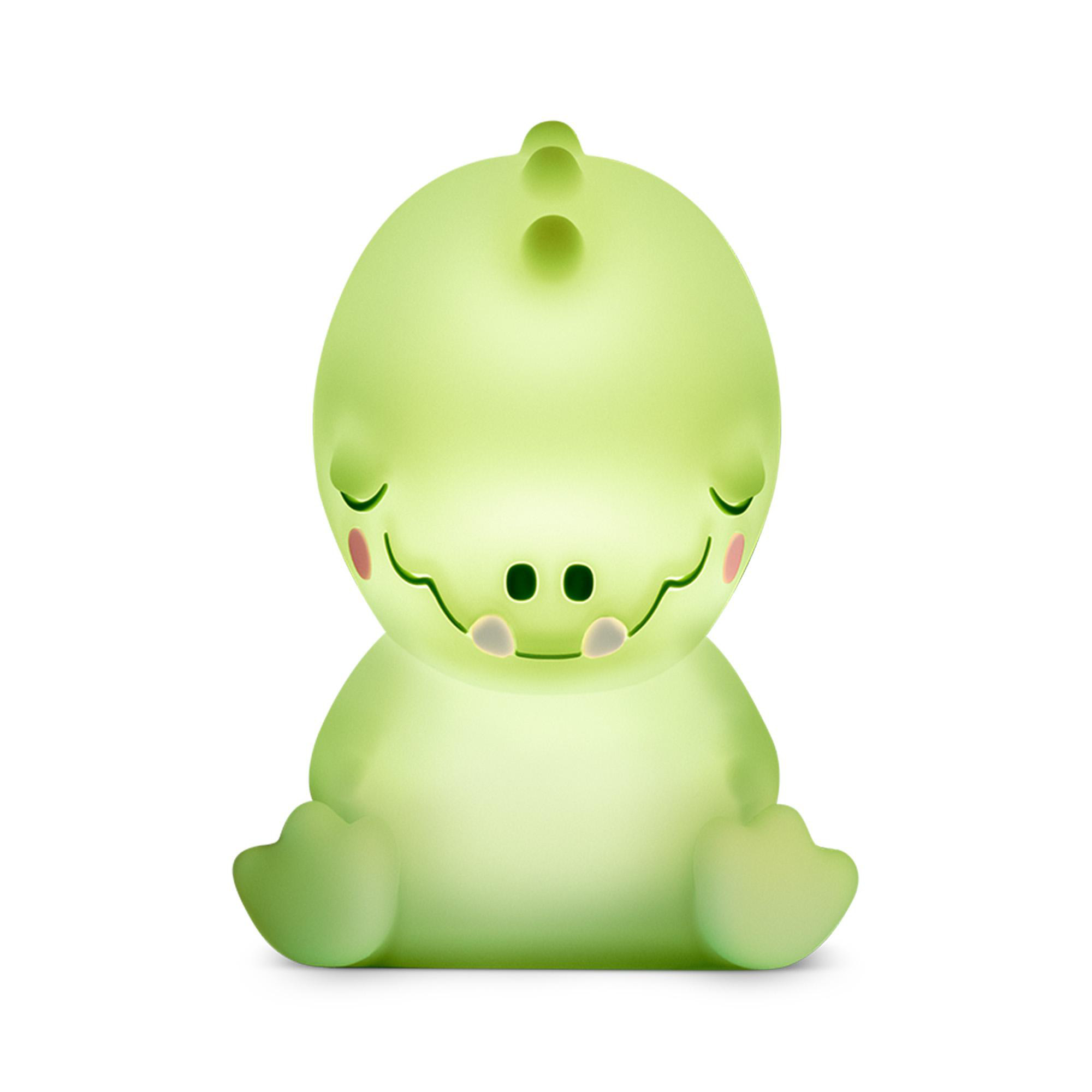 Eine leuchtende, grüne Dino-Lampe sitzt mit geschlossenen Augen und rosafarbenen Wangen.
