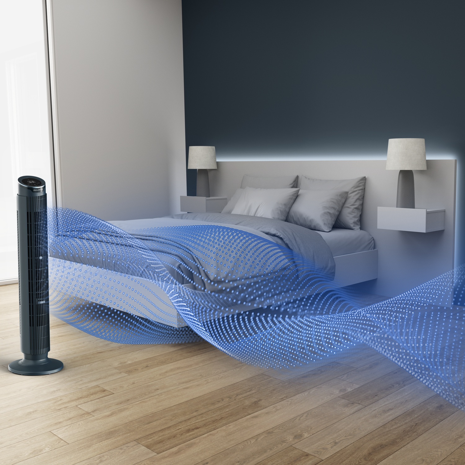 A black tower fan in a bedroom blows blue air particles onto a bed.