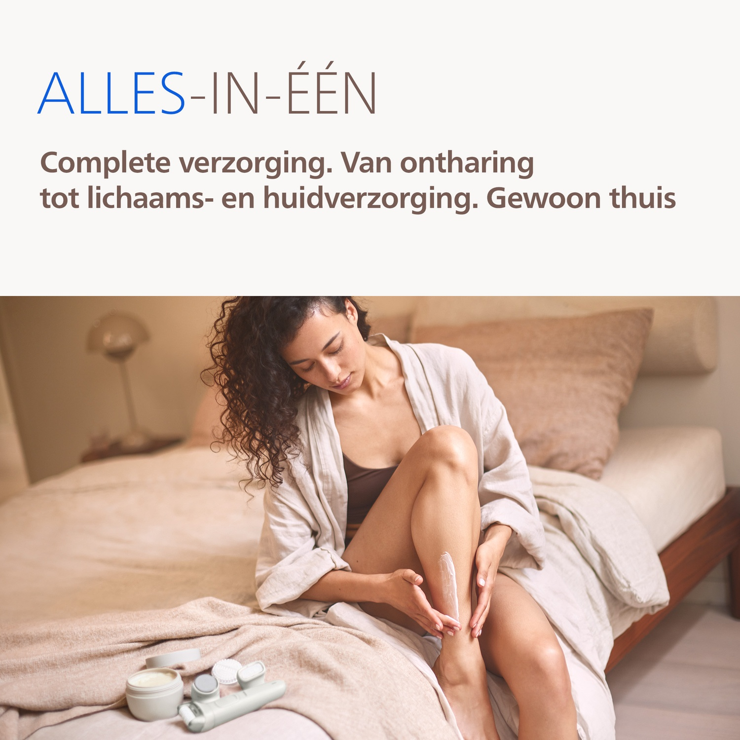 A woman applies cream to her leg, next to skincare products.