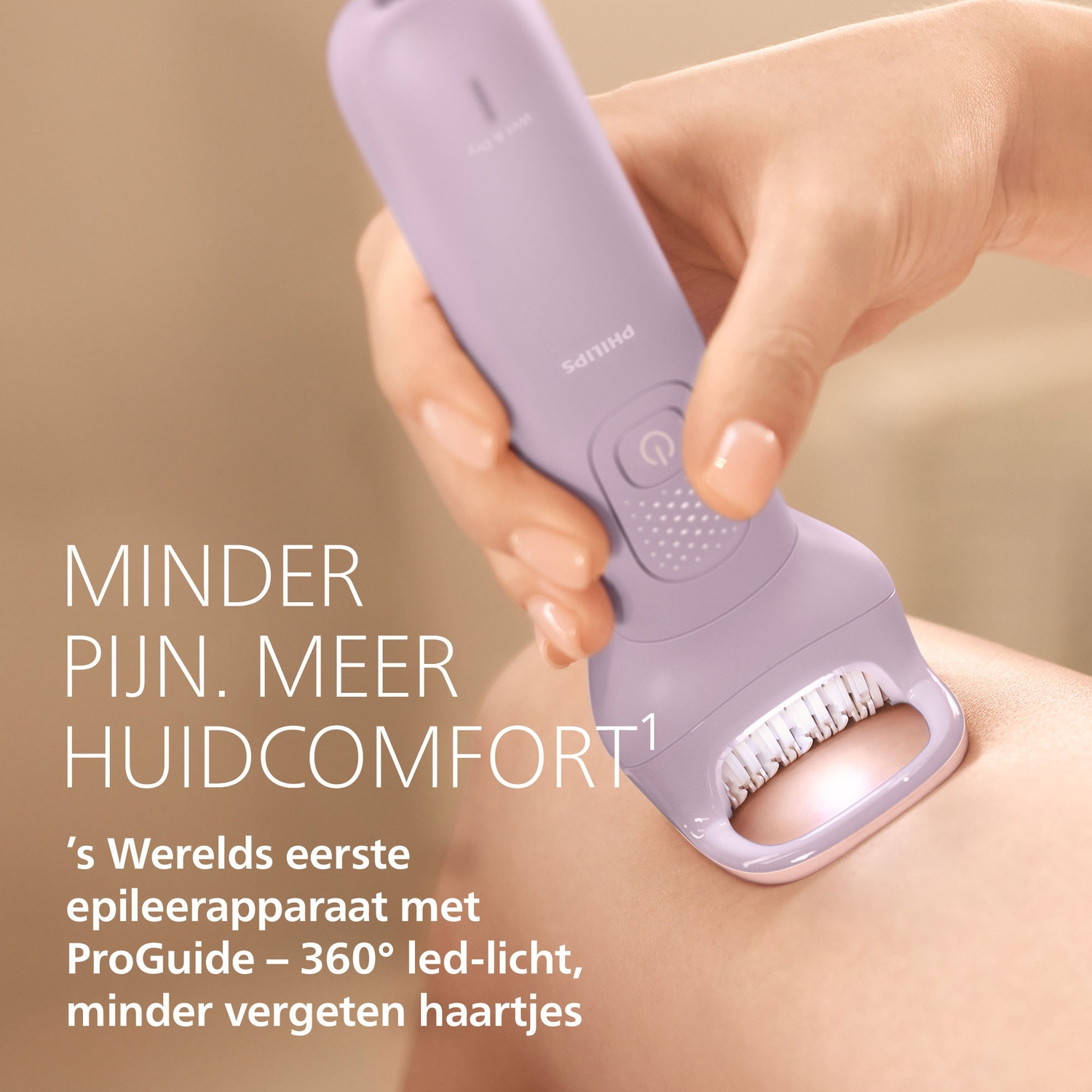 A hand holds a purple epilator being used on skin.