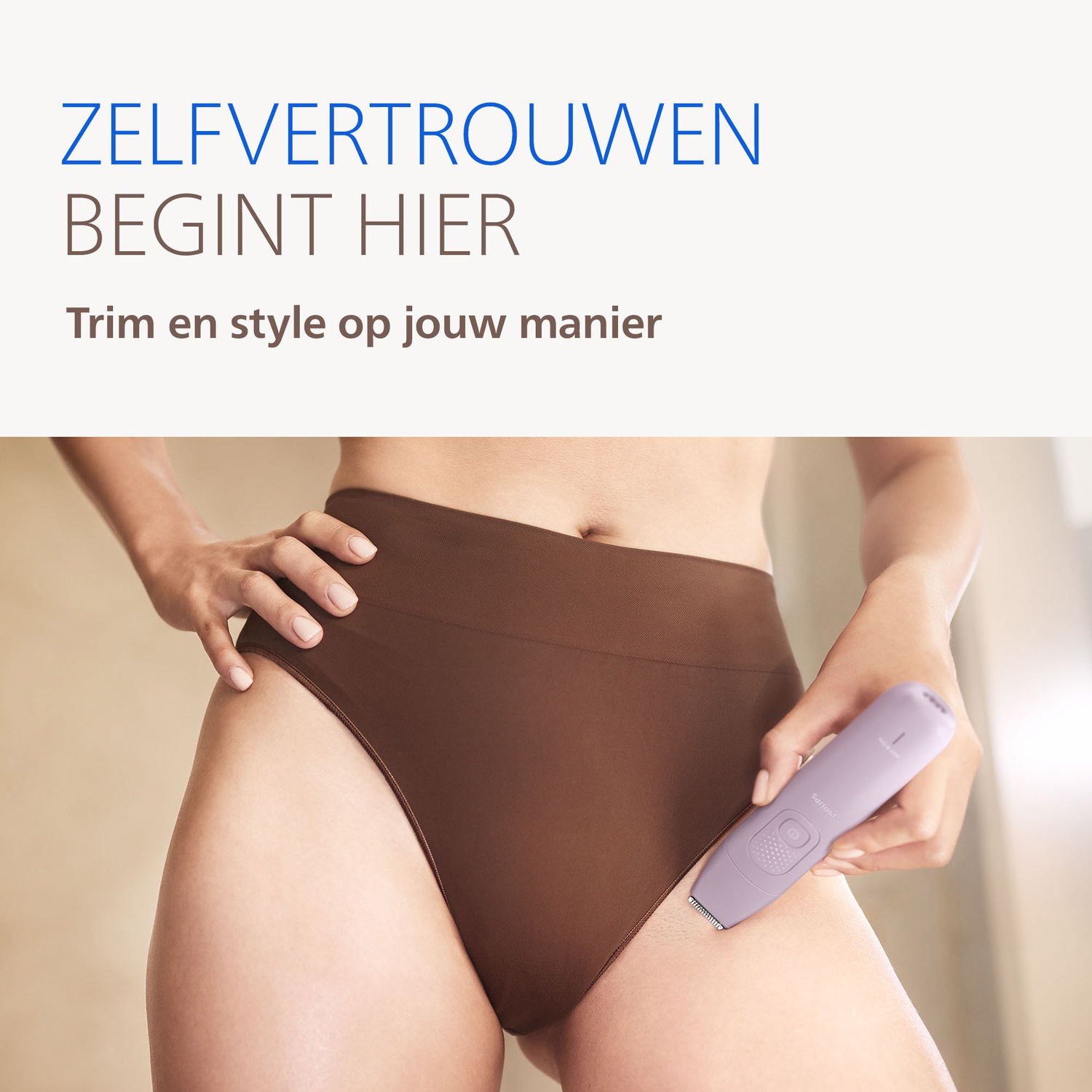 A woman trims herself with a purple epilator.