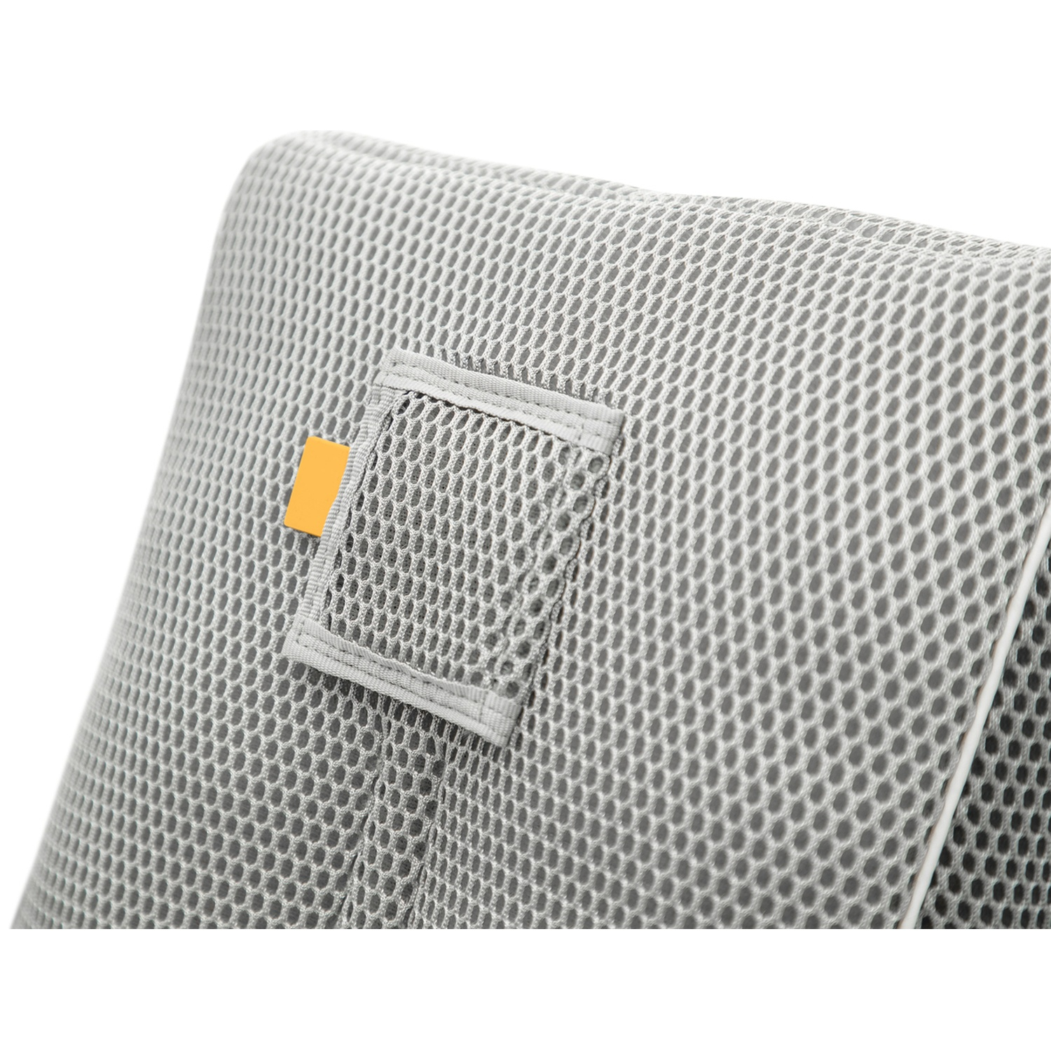 Gray mesh fabric with a small orange tag and white trim.