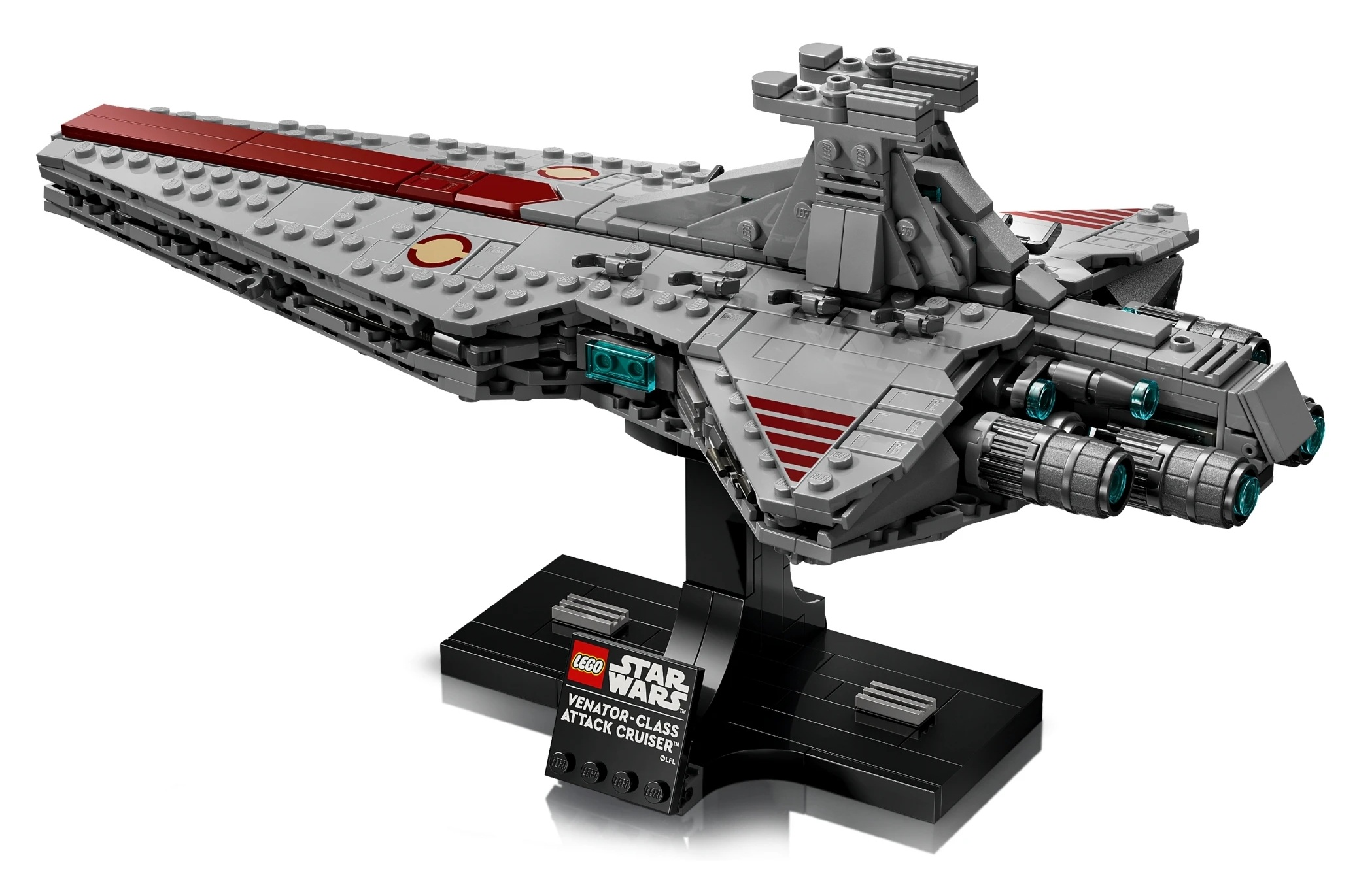 Szary statek kosmiczny Lego z czerwonymi akcentami, na czarnym stojaku.