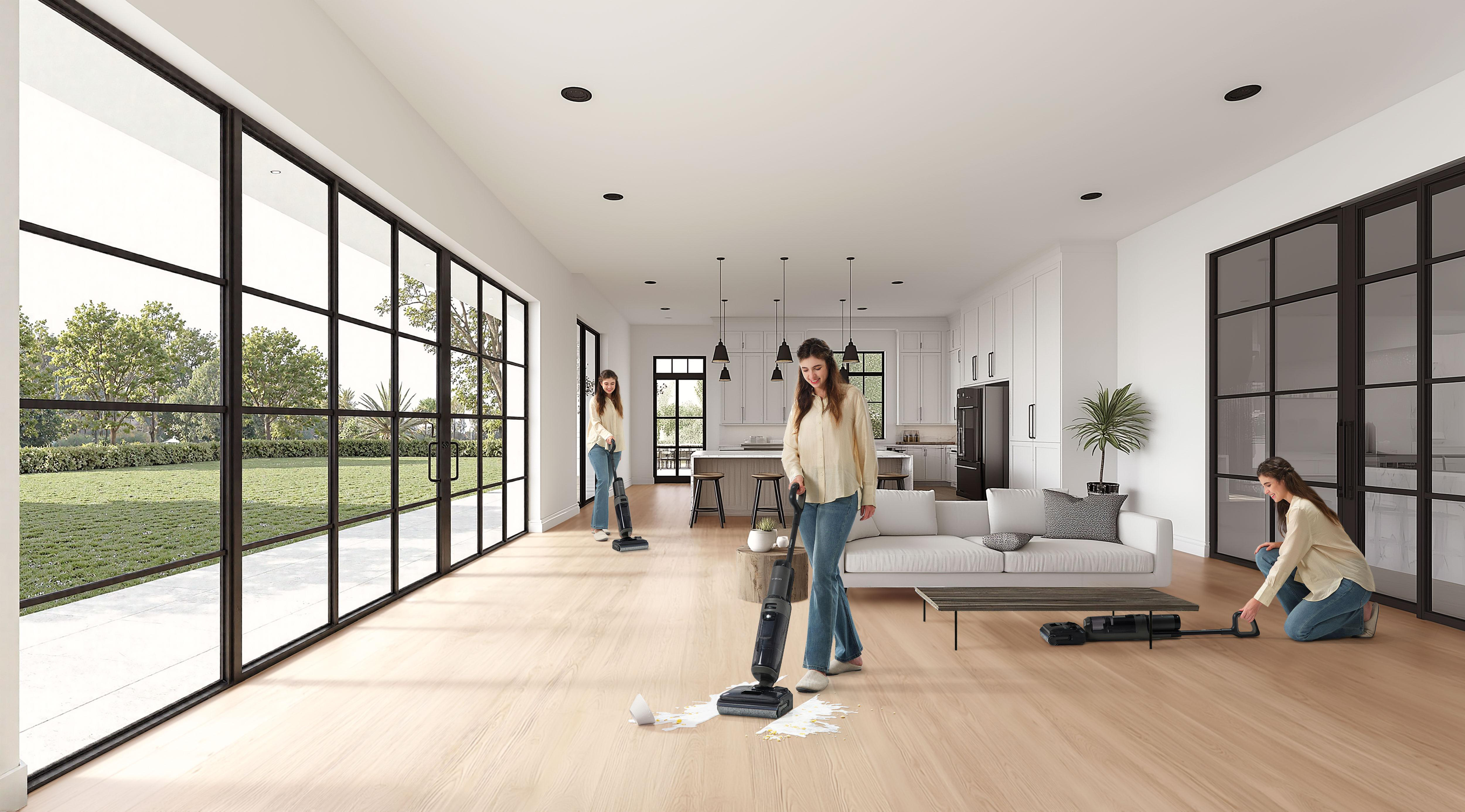 Drei Frauen reinigen ein geräumiges Wohnzimmer mit Bodenwischern.