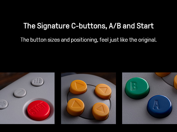 Grauer Controller mit roten START, gelben C-Tasten und blauen A/B-Tasten.