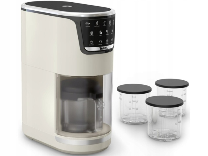Kremowa maszynka do lodów Tefal z czarną pokrywką i trzema przezroczystymi pojemnikami.