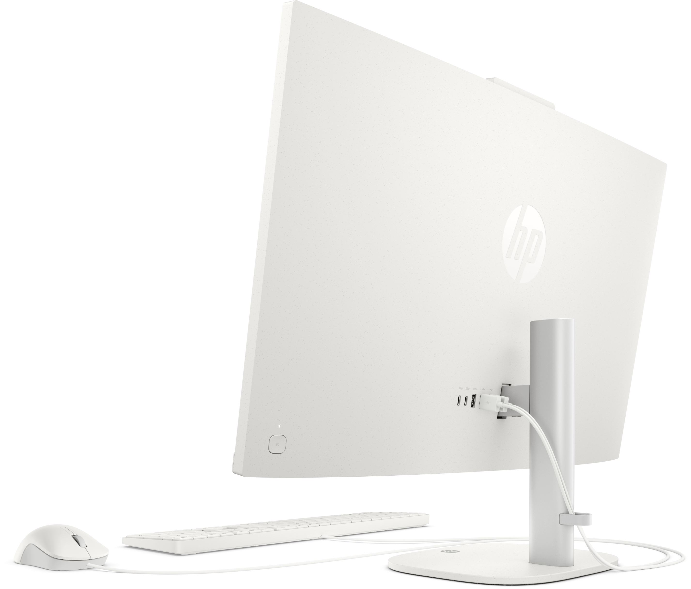 Un ordinateur tout-en-un HP blanc avec clavier et souris sur fond noir.