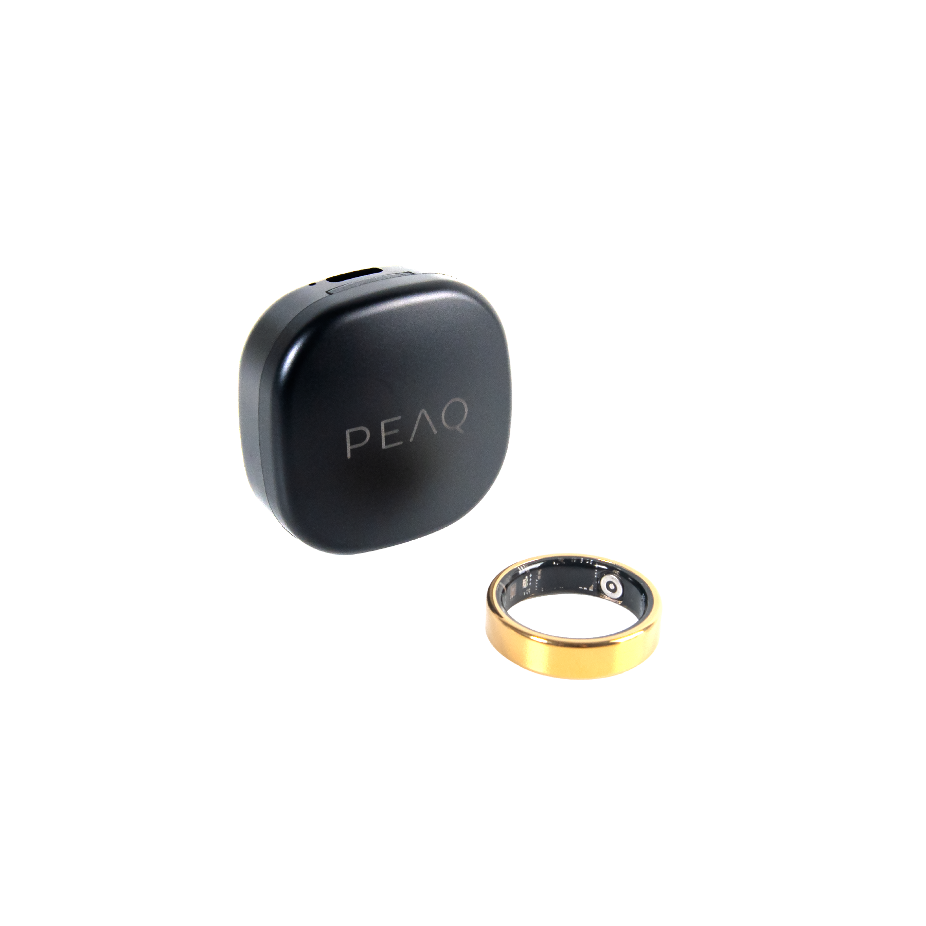 Ein schwarzes Ladeetui und ein goldener Ring mit innerer Elektronik.