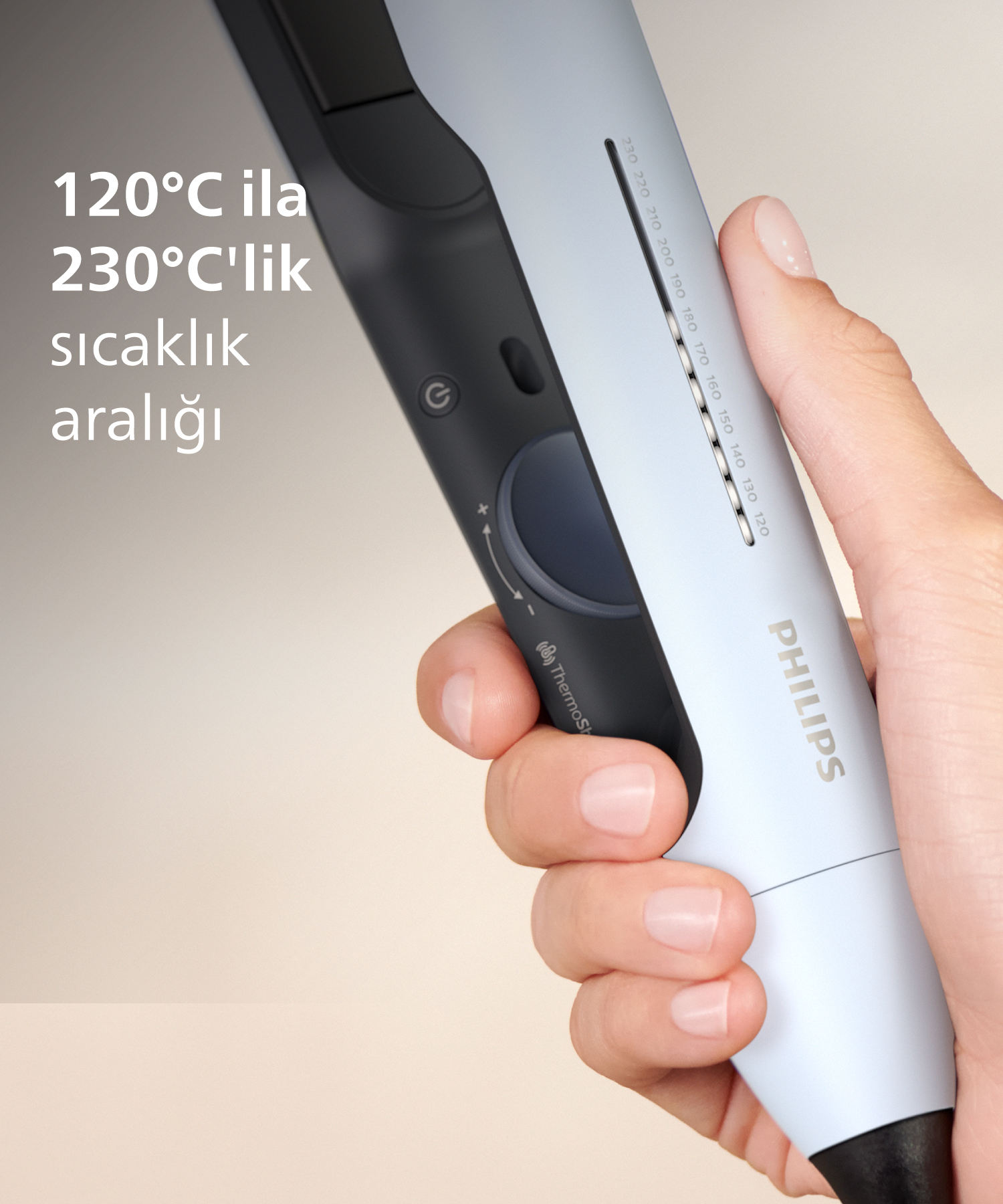 Bir el, sıcaklık ayarları olan açık mavi bir Philips saç düzleştirici tutuyor.