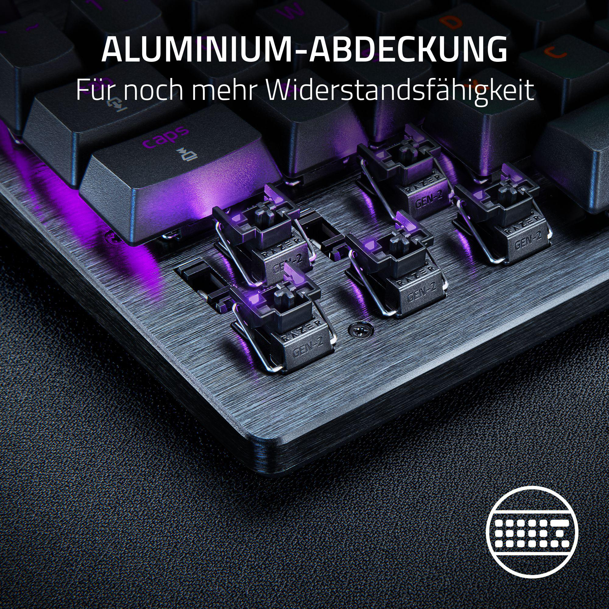Nahaufnahme von Tastenschaltern mit violetter Beleuchtung und Aluminiumoberfläche.