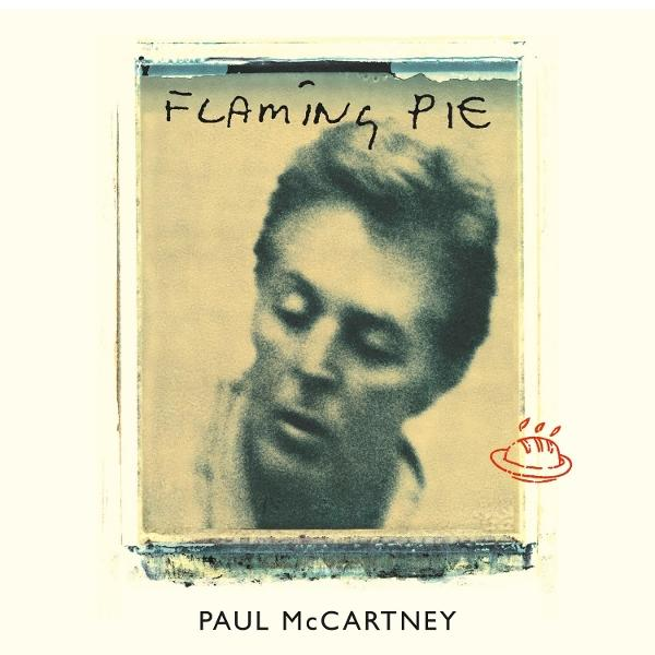Paul McCartney mit "Flaming Pie"-Schriftzug und Kuchen-Symbol.
