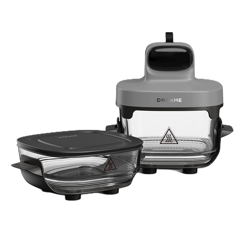 Szara frytkownica beztłuszczowa ze szklaną misą i czarną pokrywką, na białym tle.