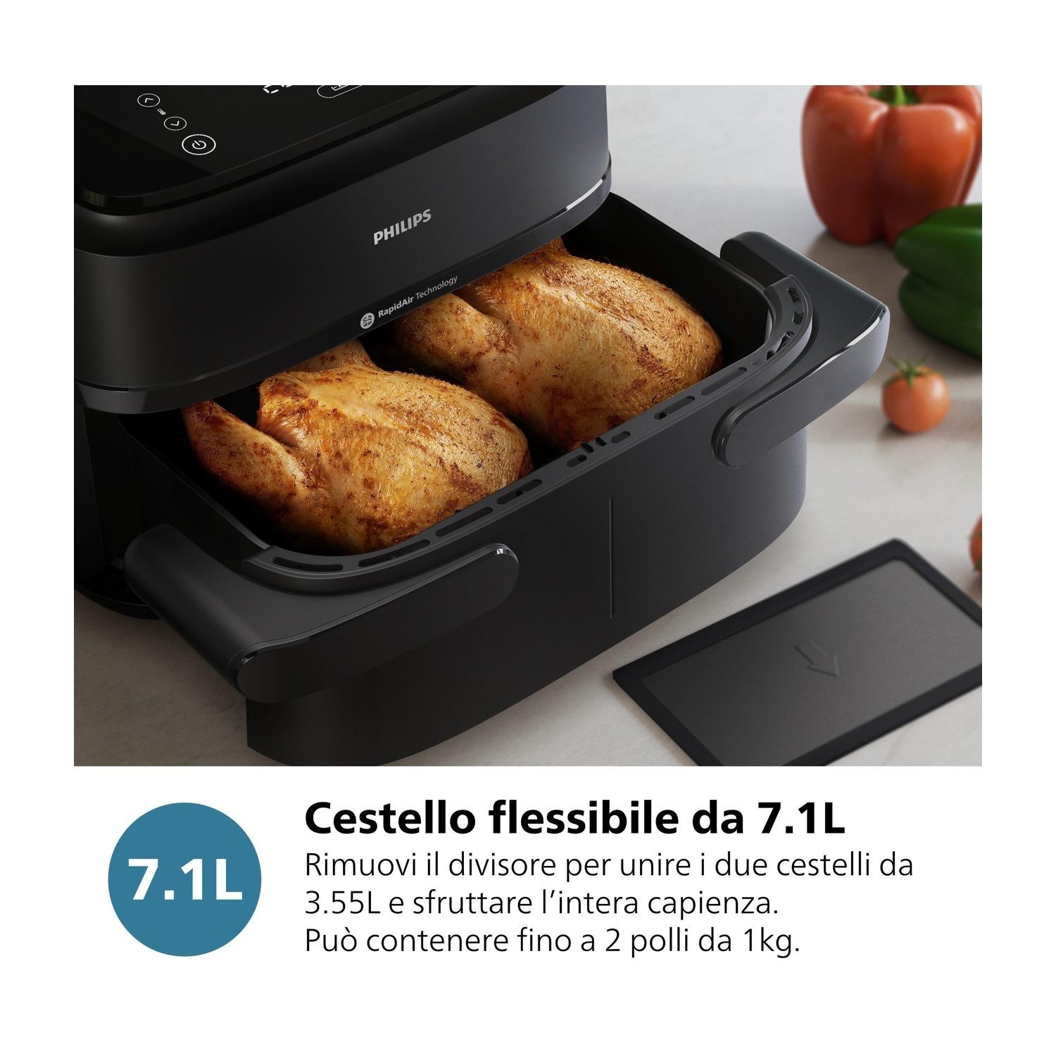 Una friggitrice ad aria Philips nera con due polli interi dorati nel cestello.
