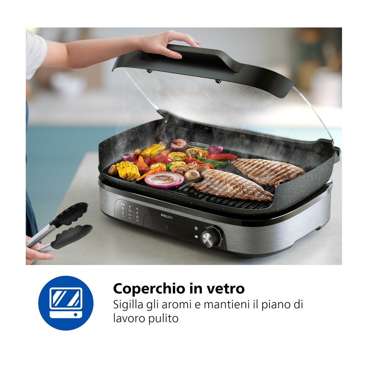 Persona solleva coperchio in vetro grill Philips con verdure e carne grigliate.