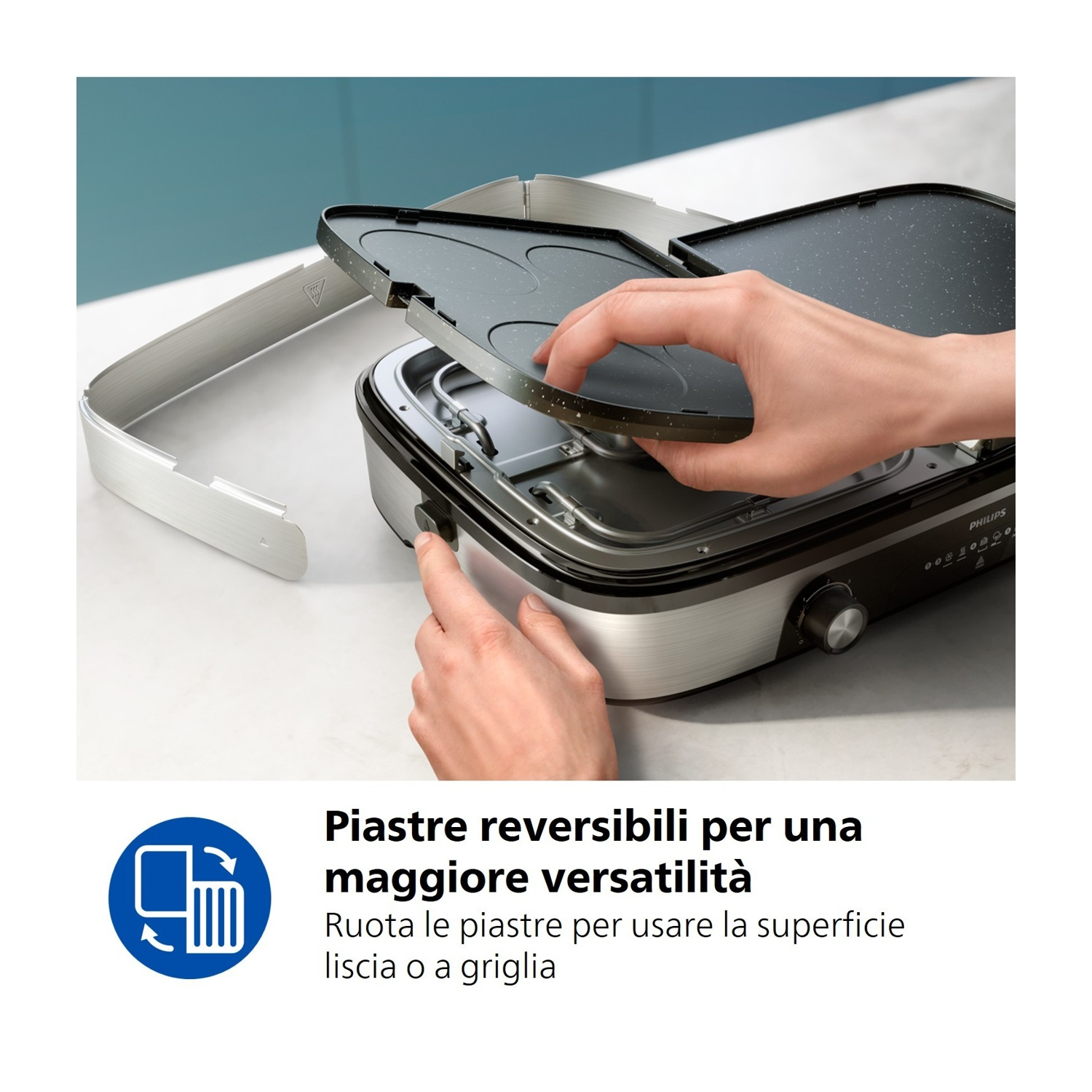 Persona che cambia le piastre reversibili di una griglia.