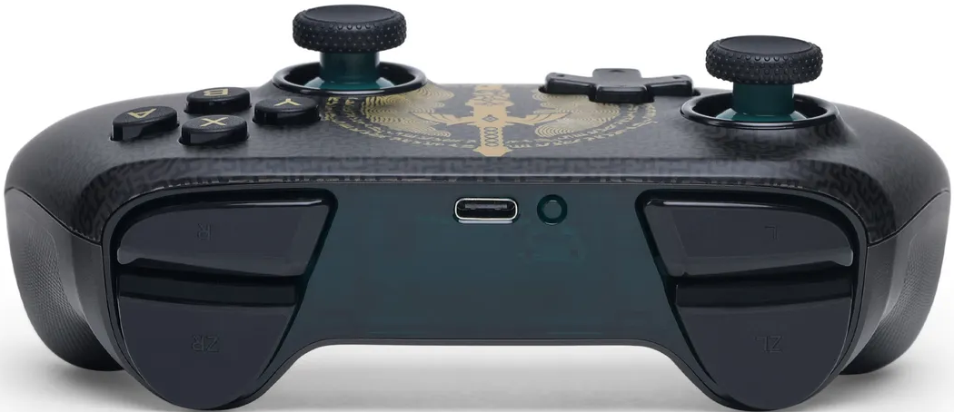 Ein schwarzer Gamecontroller mit goldener Verzierung, zwei Joysticks und Knöpfen.