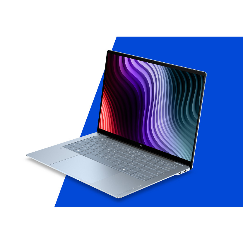 Ein silberner Laptop mit einem bunten, wellenförmigen Hintergrund.