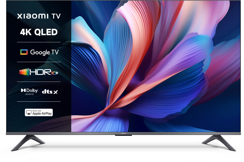 Telewizor Xiaomi 4K QLED wyświetla kolorowy obraz abstrakcyjny. Funkcje: Google TV, HDR10+, Dolby, DTS:X, Apple AirPlay.