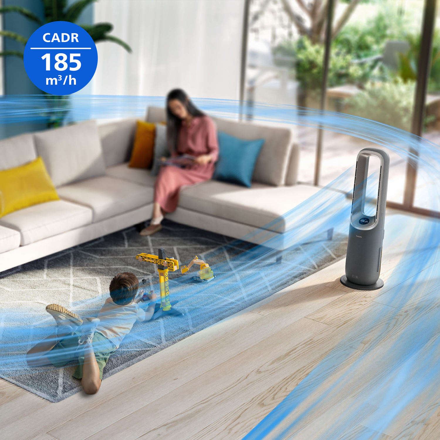 An air purifier generates airflow. A child plays on the floor, a woman sits on the sofa.