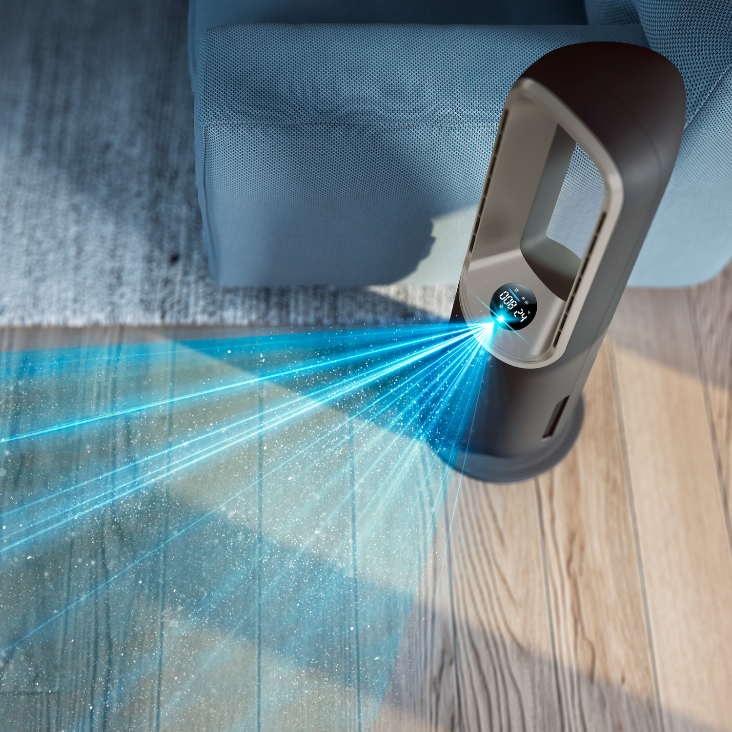 A tower fan blows blue air onto a wooden floor next to a sofa.