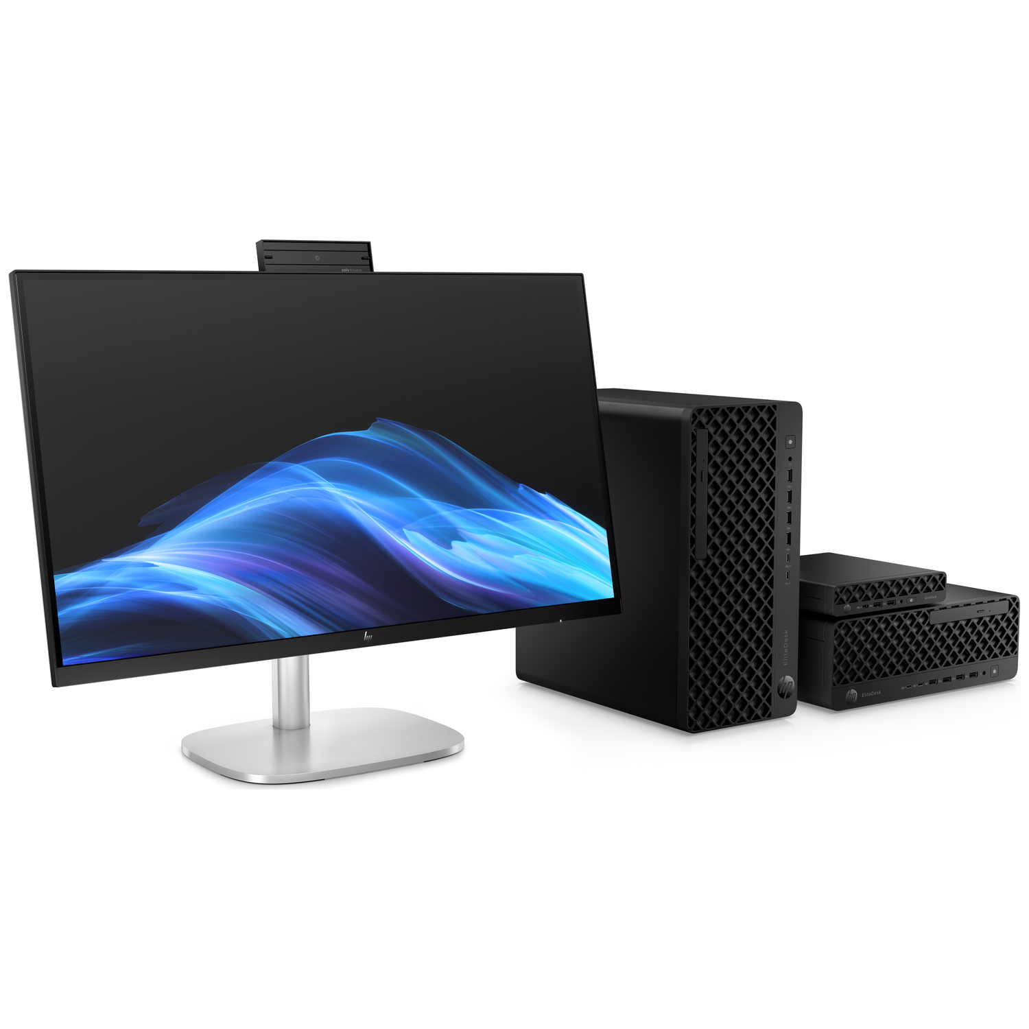 A black PC tower and two smaller black PCs sit beside a monitor.