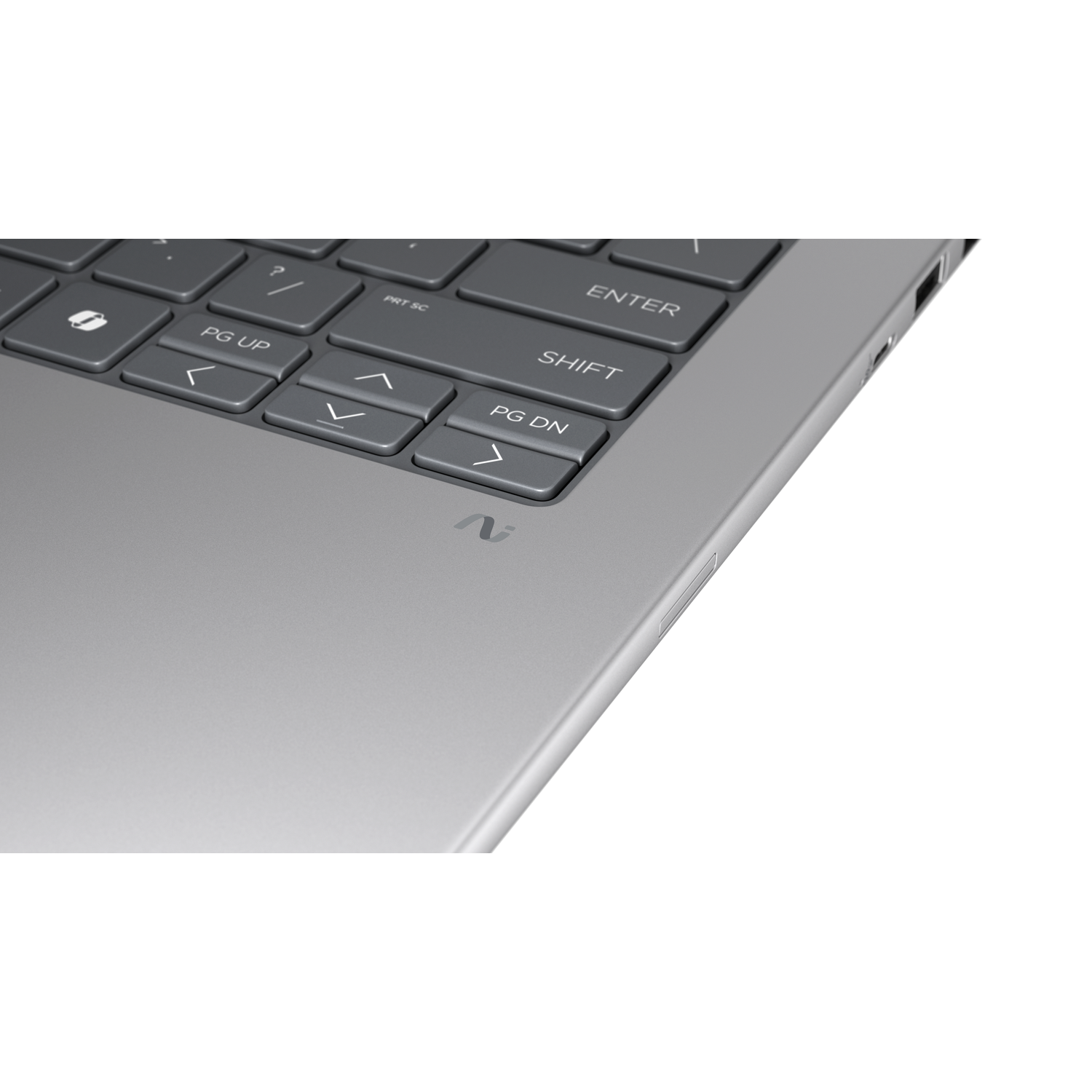 Close-up van een grijs laptoptoetsenbord met 'Enter' en 'Shift' toetsen.