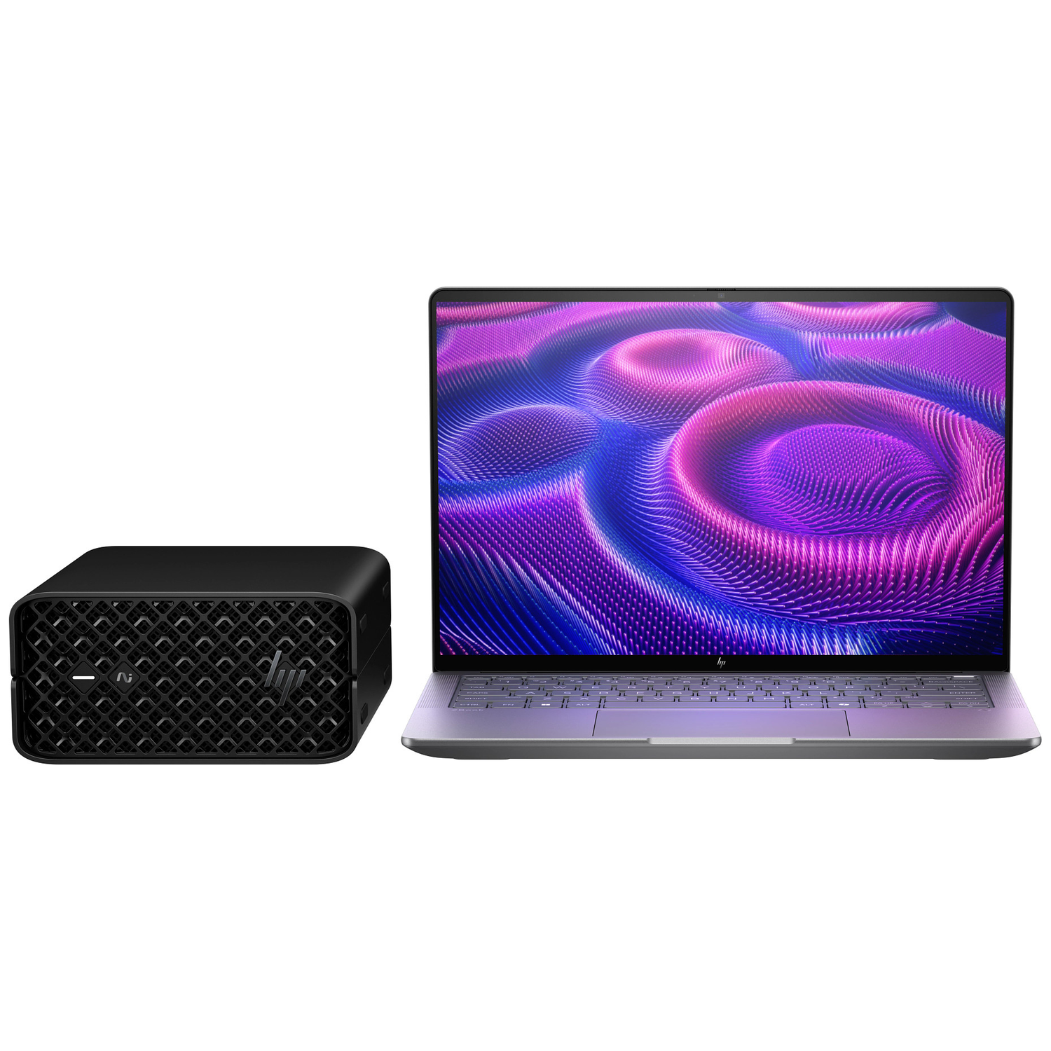 A black mini PC and a silver laptop with a purple abstract background on screen.