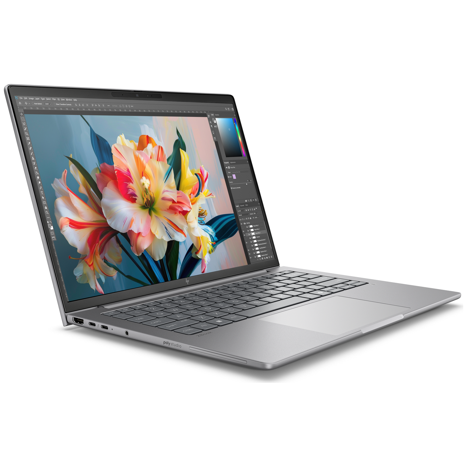 A silver laptop displays a vibrant floral image on its screen.