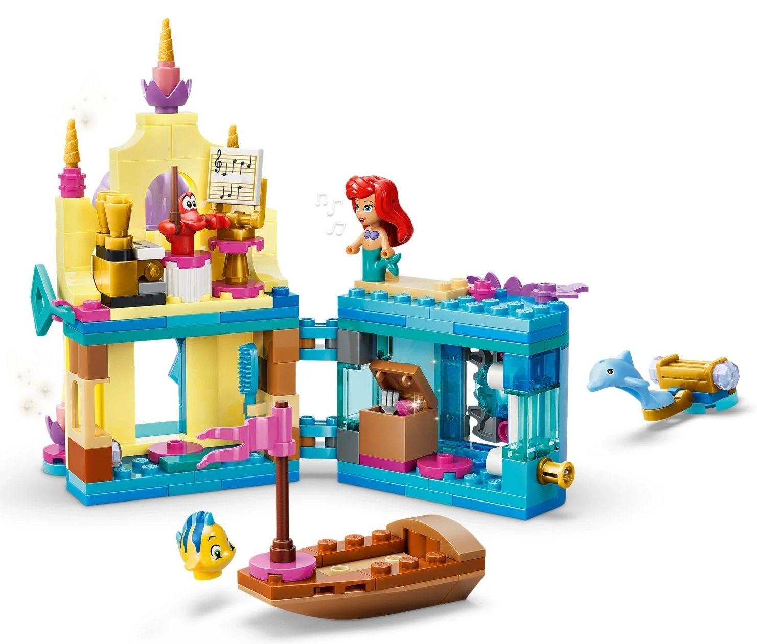 Kolorowa podwodna sceneria Lego z zamkiem, postaciami, łodzią, delfinem i rybą.