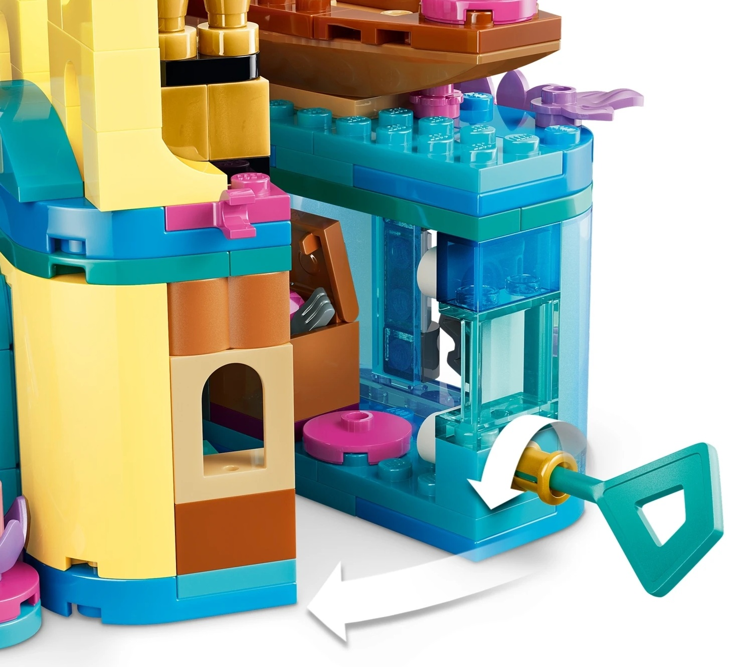 Kolorowy zamek Lego z turkusowym kluczem obracanym w niebieskim mechanizmie.