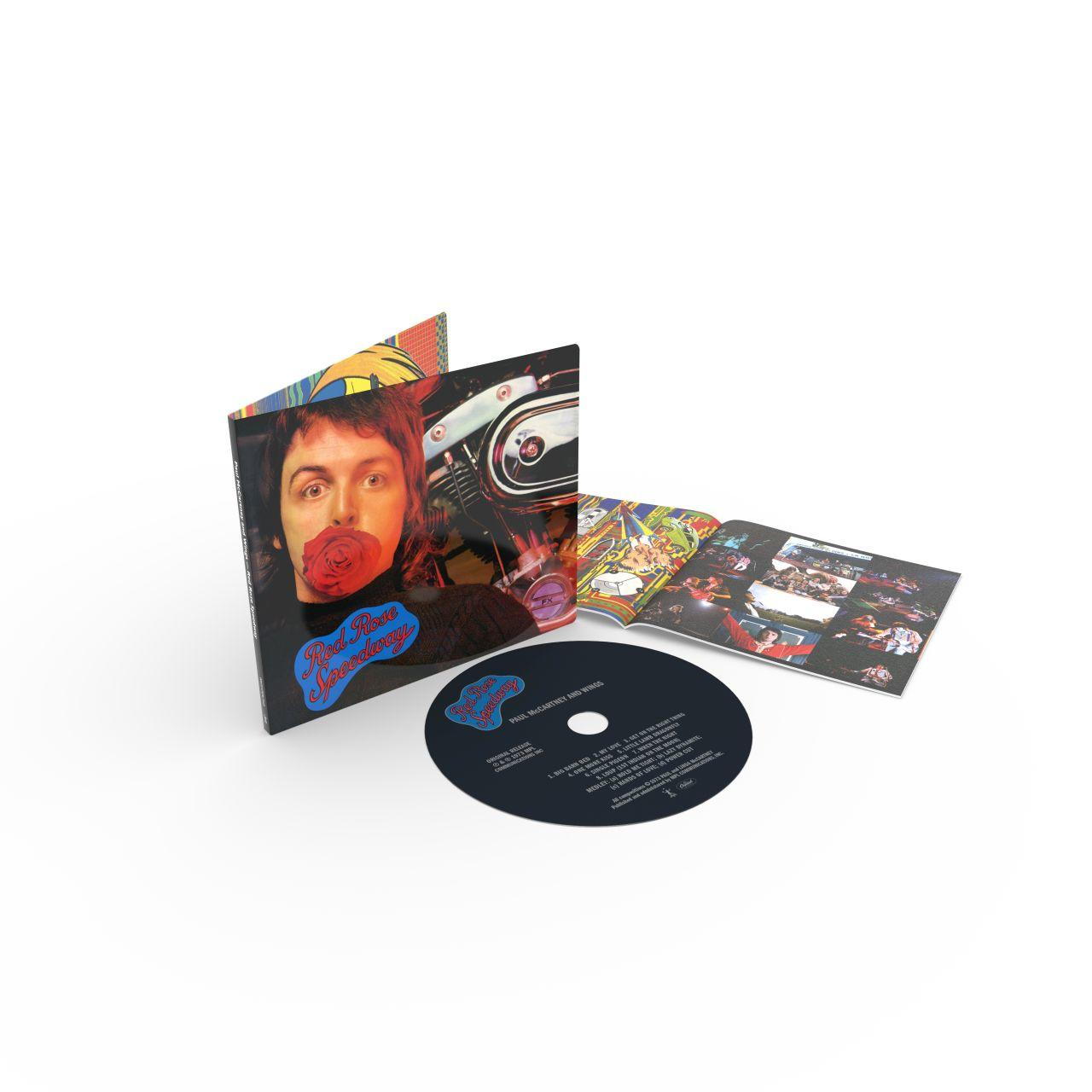 Albumhoes met Paul McCartney, een roos in zijn mond, en een CD.