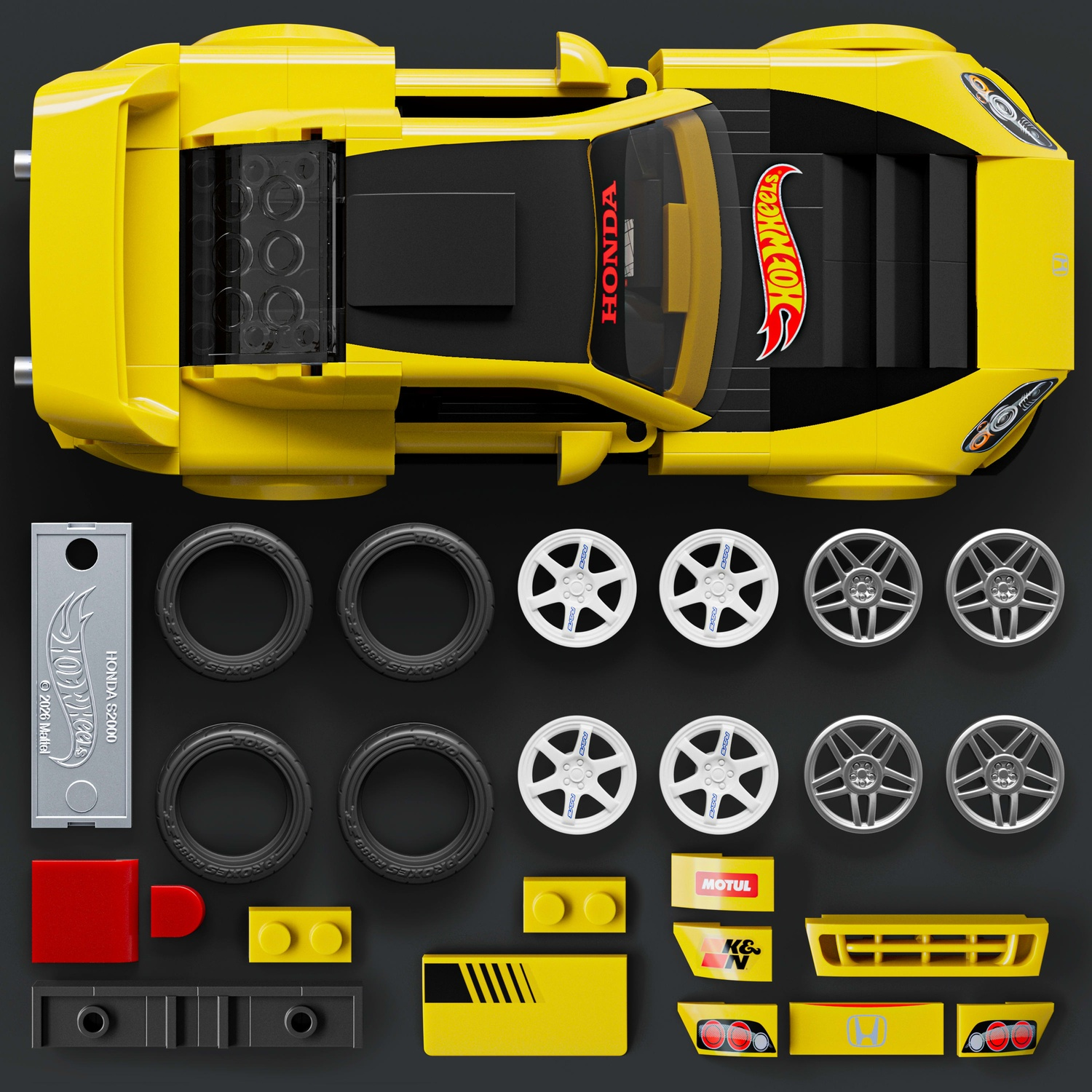 Auto sportiva Lego gialla con parti: pneumatici, ruote, spoiler e altro.