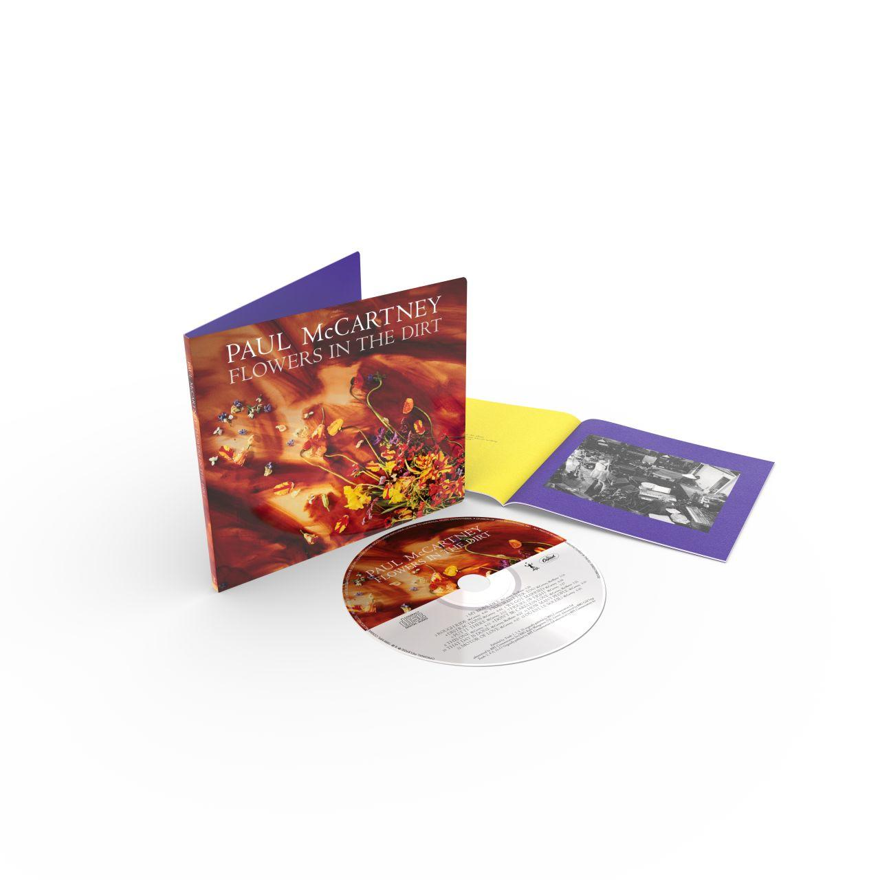 Paul McCartneys Flowers in the Dirt CD und Booklet mit lebendiger Blumenkunst.