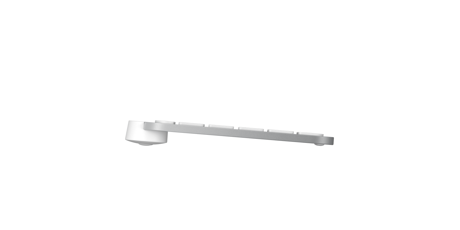 Srebrna klawiatura z białymi klawiszami widok z boku na czarnym tle.