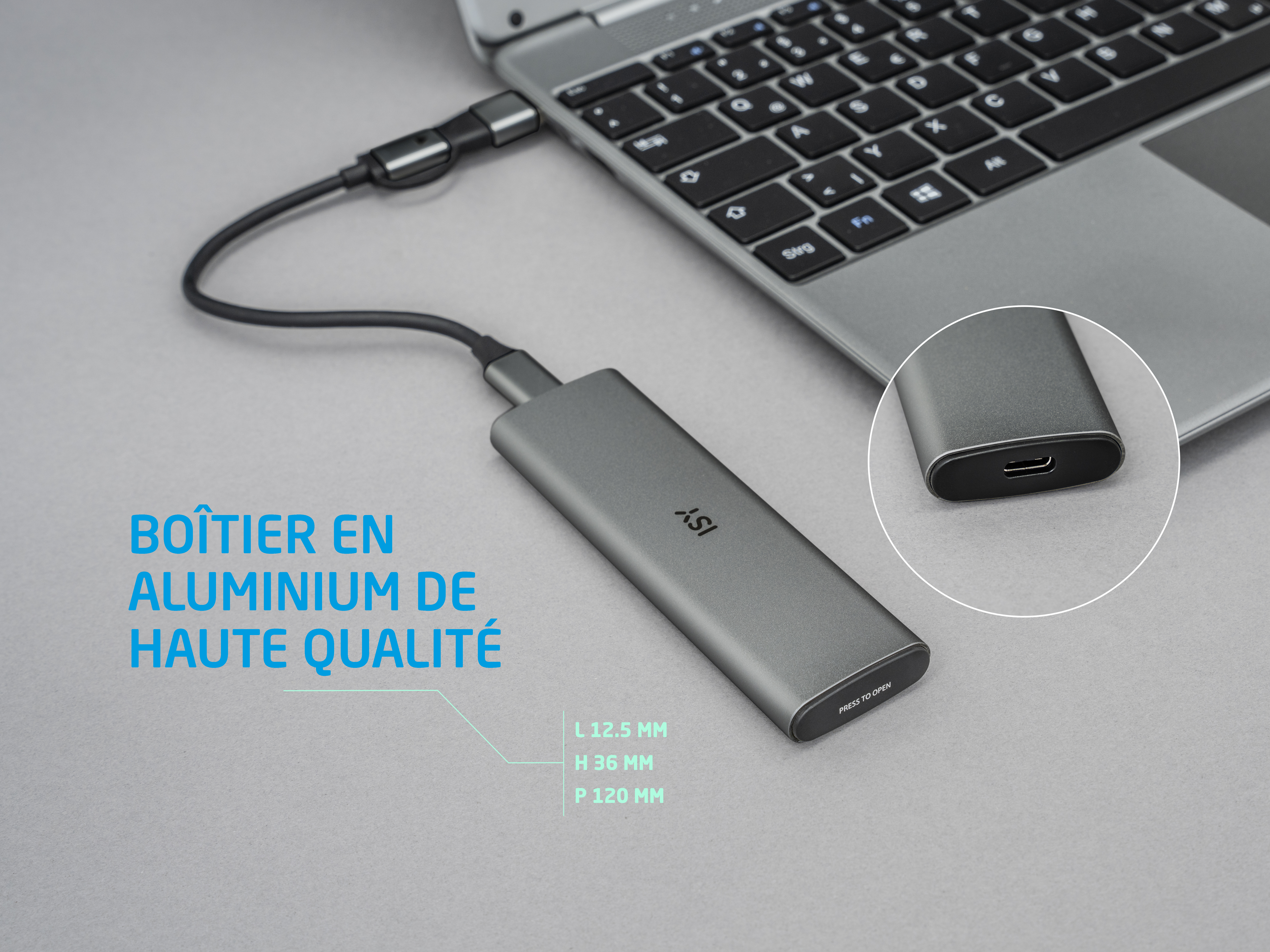 Szara zewnętrzna obudowa dysku twardego z portem USB-C, podłączona do laptopa.
