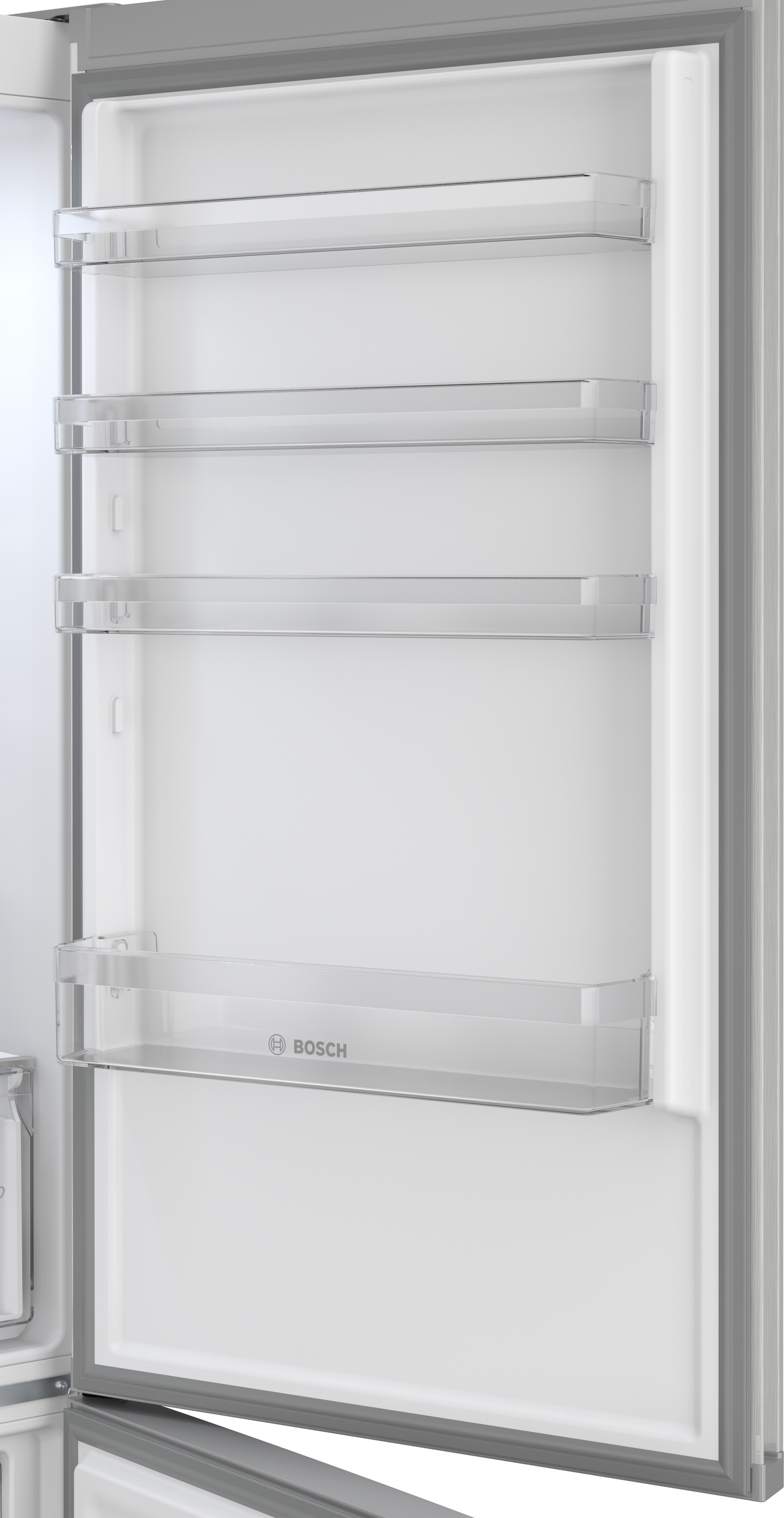 Widok wnętrza pustej lodówki z szklanymi półkami i logo Bosch.