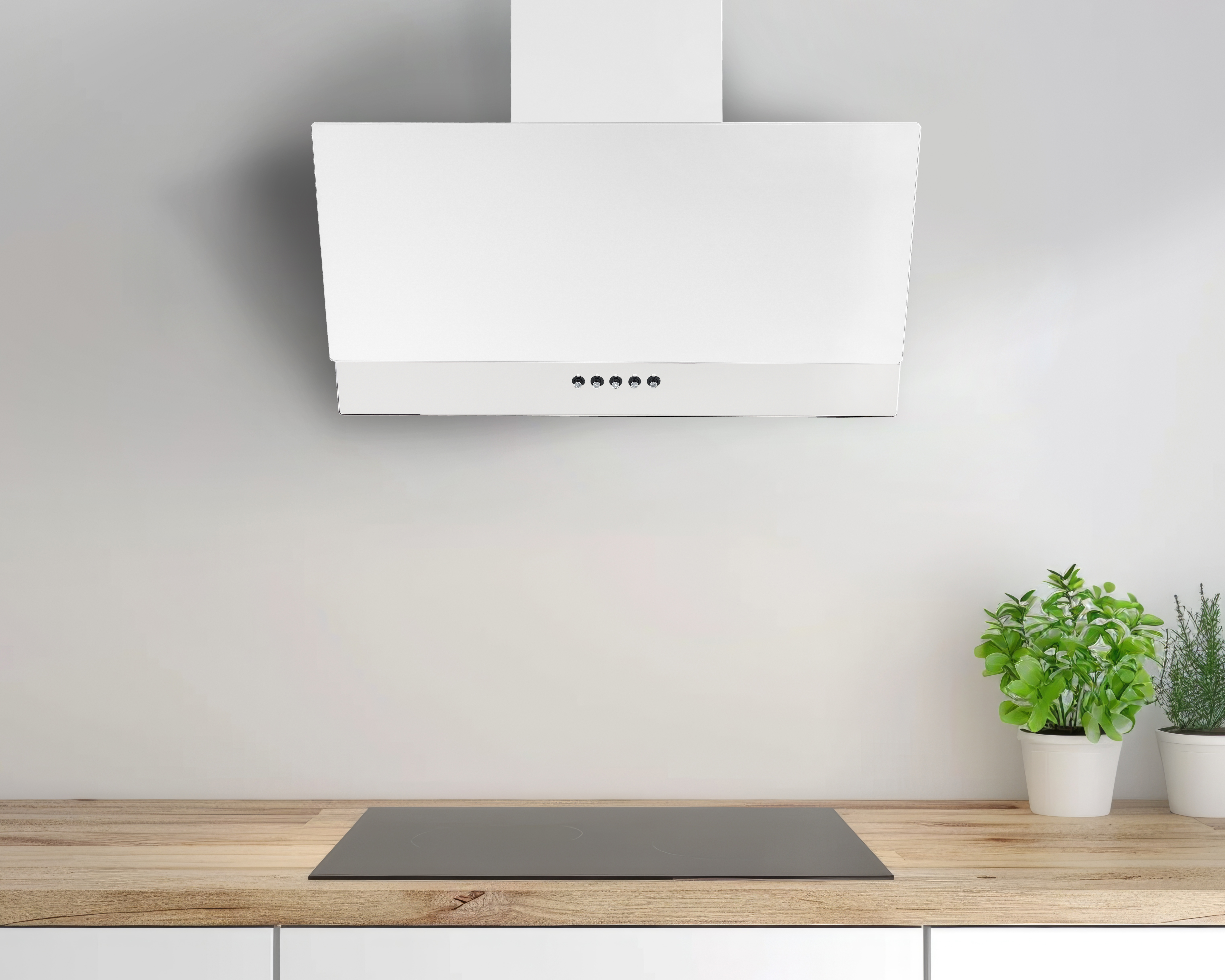 Nowoczesny biały okap nad płytą grzewczą na drewnianym blacie.