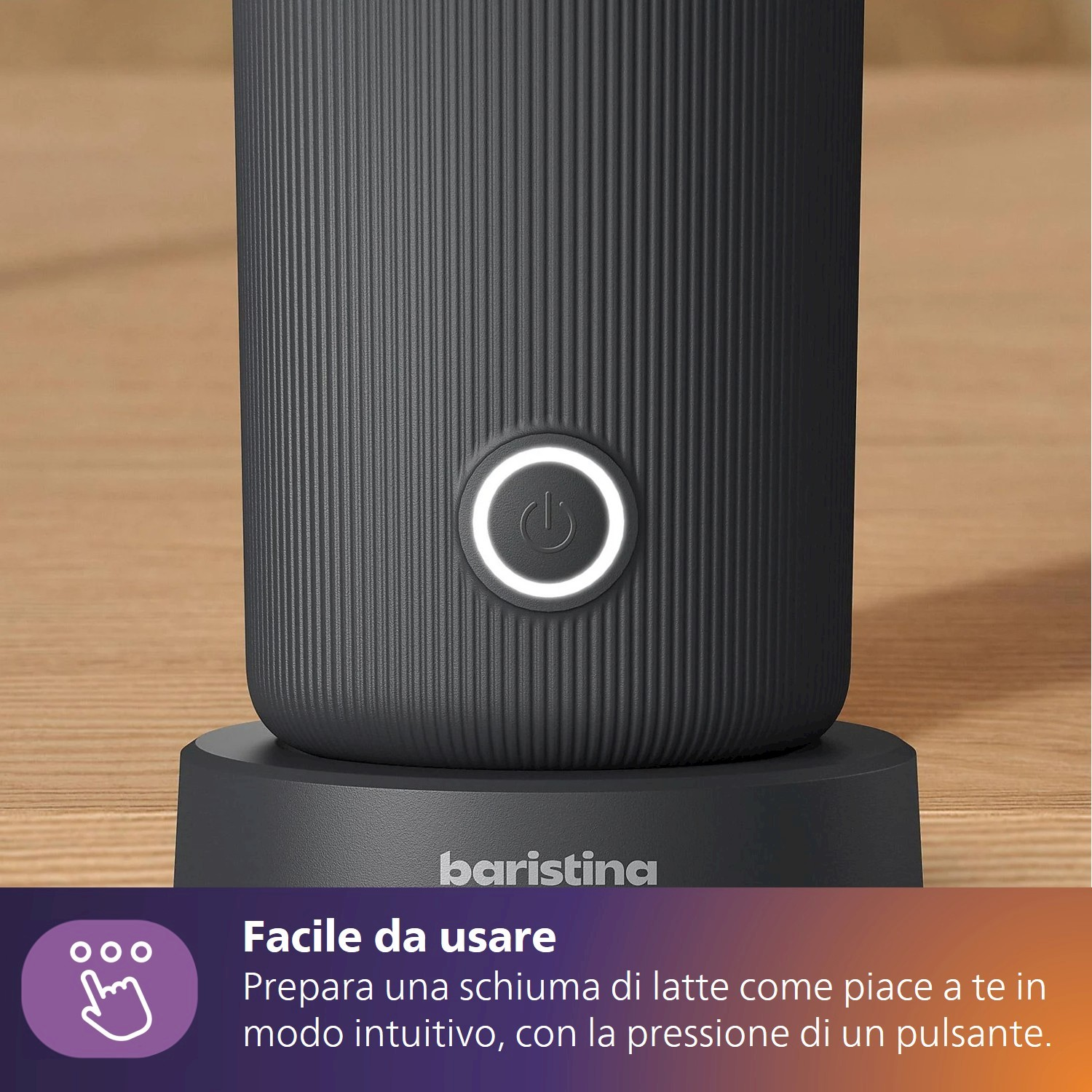 Meringatore scuro con pulsante di accensione illuminato e texture a coste.