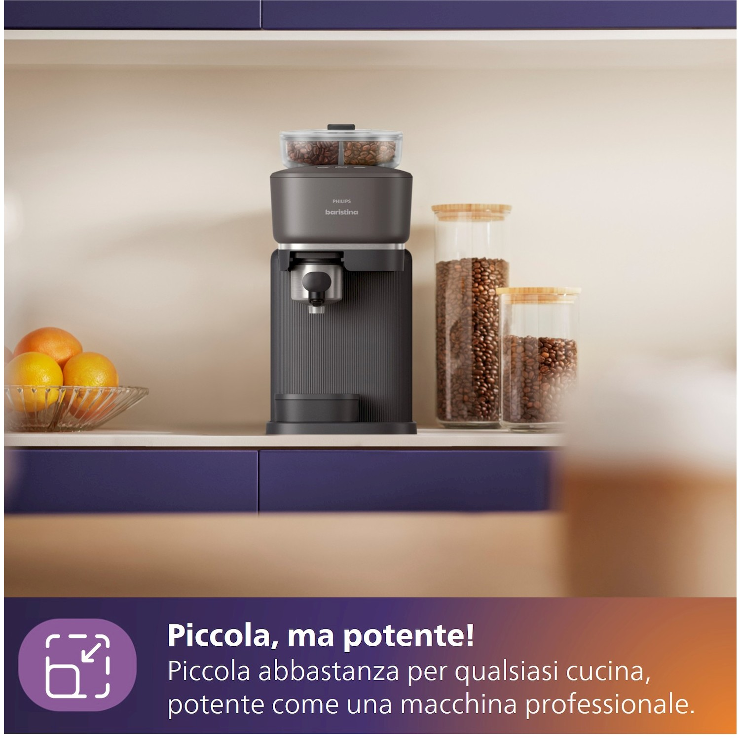 Macchina caffè grigio scuro con contenitore chicchi, arance e barattoli caffè.