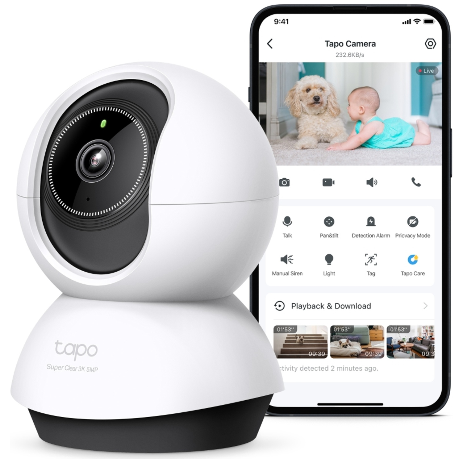 White security camera next to smartphone showing baby and dog.
