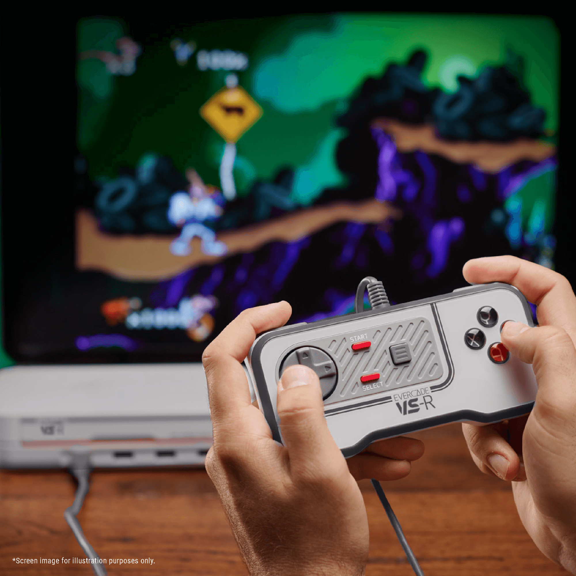 Hände halten einen weißen und grauen Videospiel-Controller vor einem verschwommenen Bildschirm.