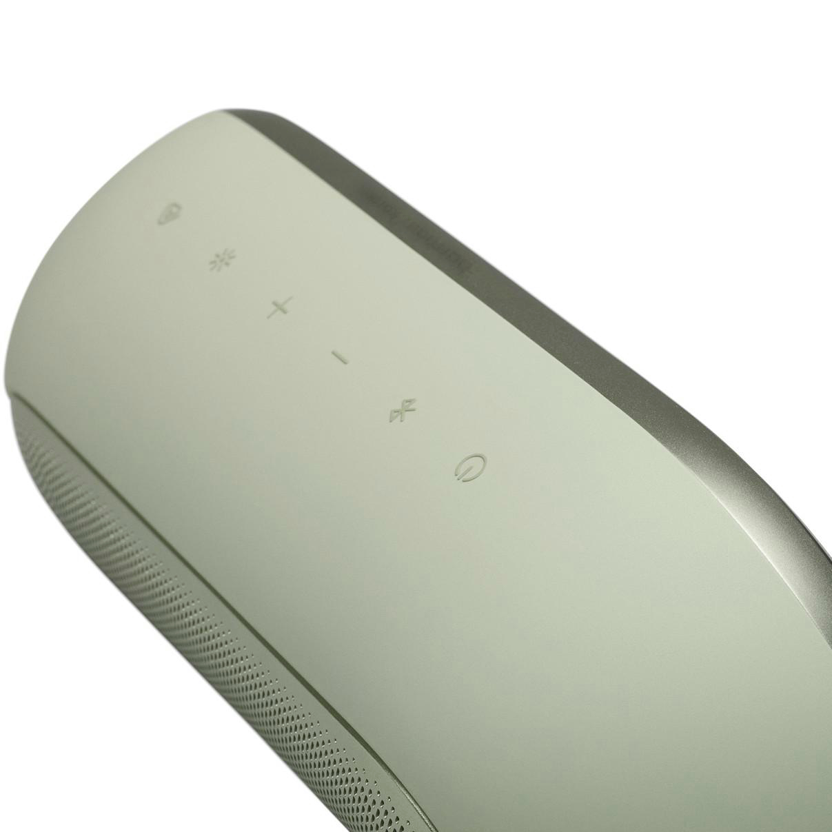 Ein silberner Lautsprecher mit beleuchteten Symbolen für Lautstärke, Bluetooth und Strom.