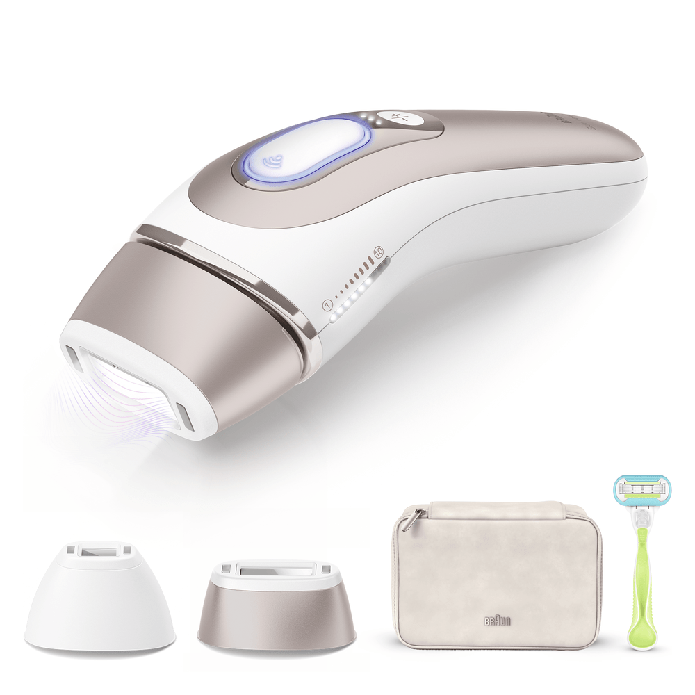 Dispositivo depilador IPL con accesorios: cuchilla, neceser y adaptadores.