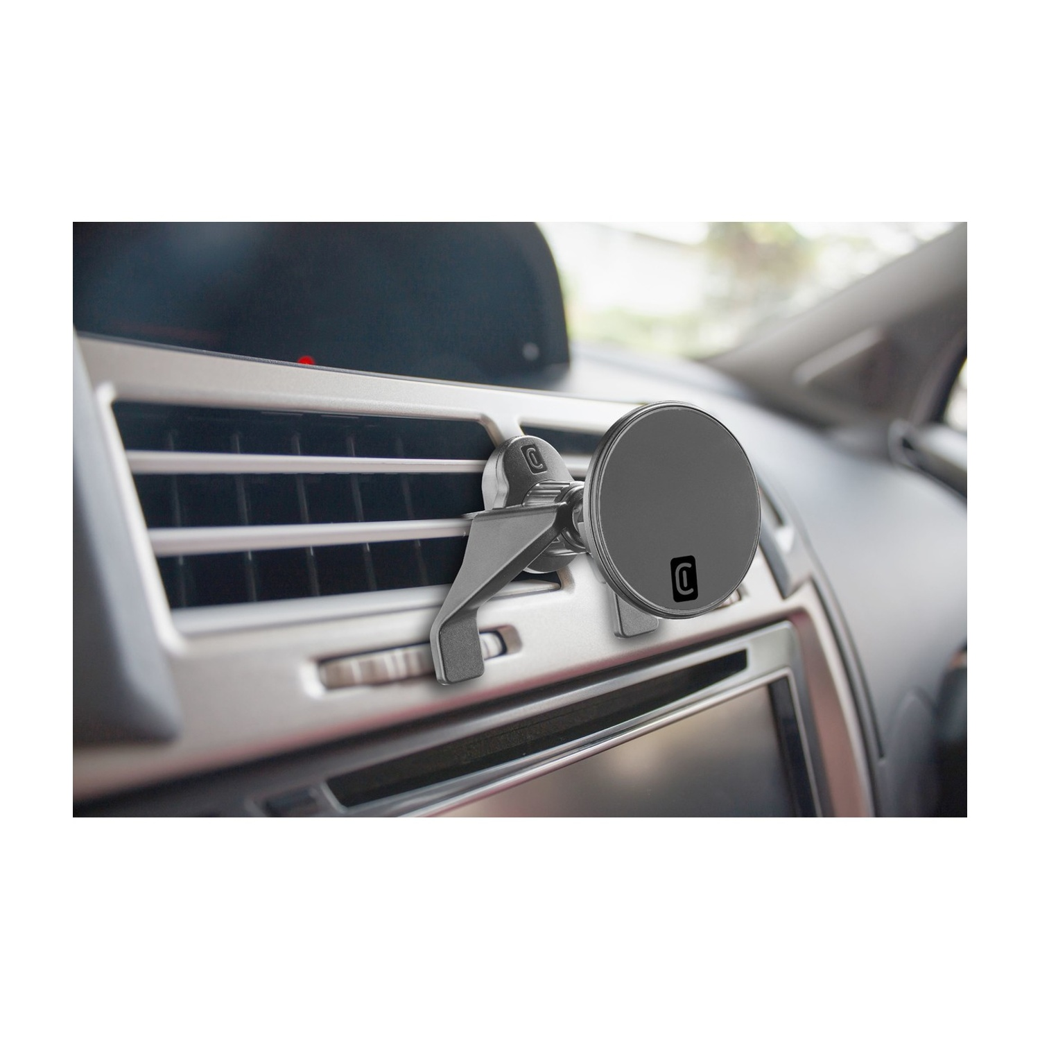 Supporto magnetico grigio per telefono attaccato a una bocchetta d'aria.