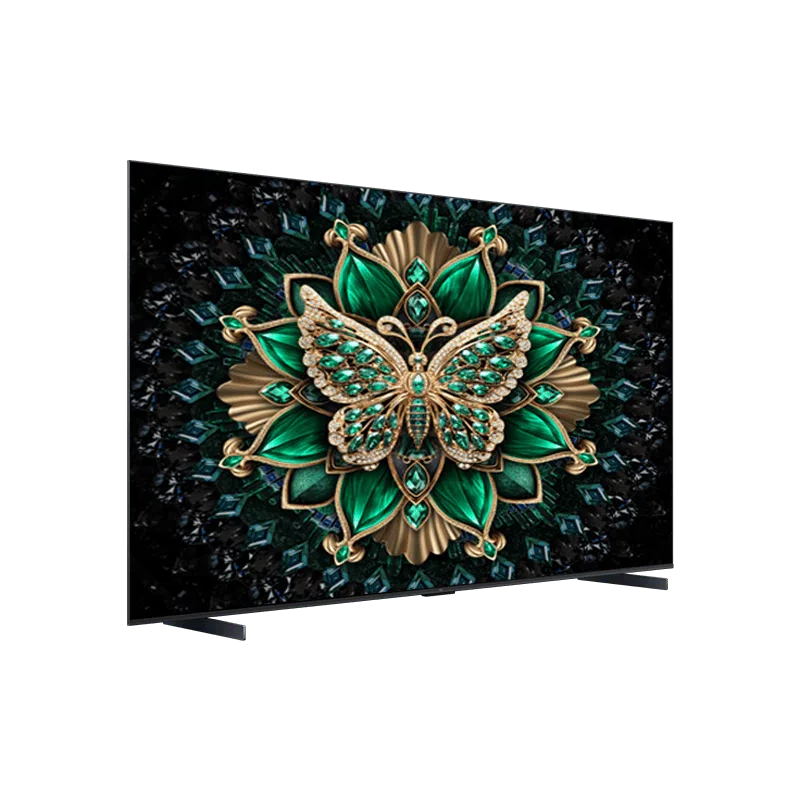 Yeşil ve altın rengi değerli taşlarla süslenmiş kelebek resmi gösteren bir TV.