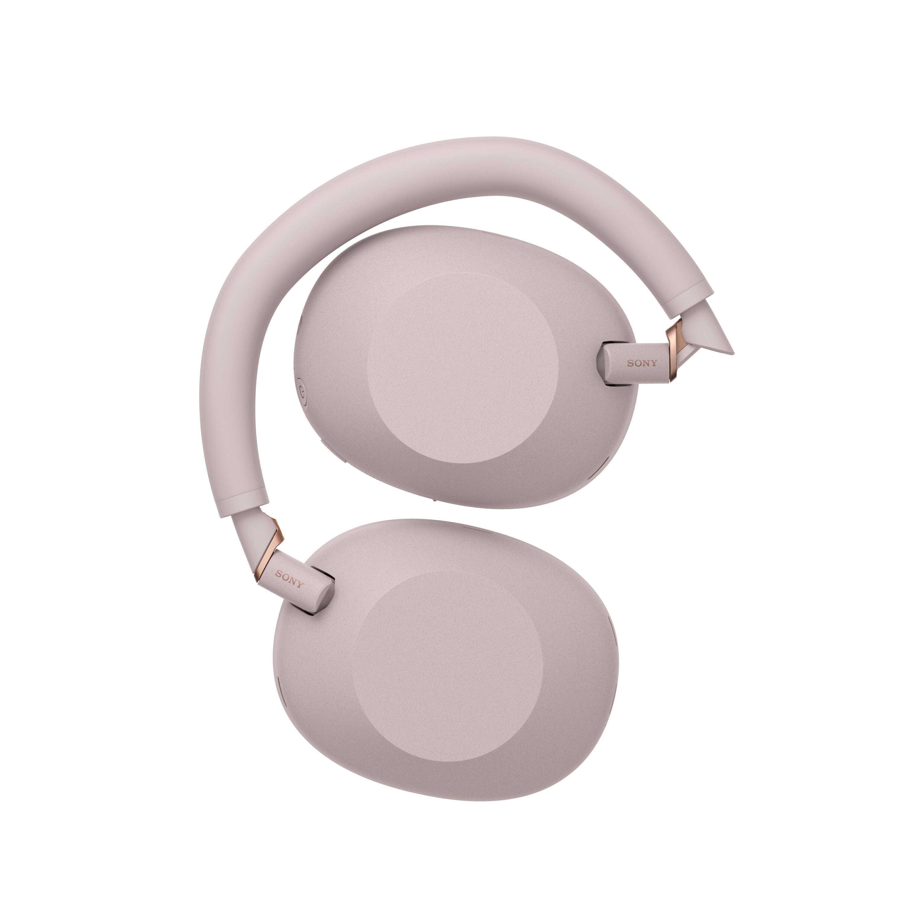 Unos auriculares Sony rosas con detalles dorados, sobre fondo blanco.