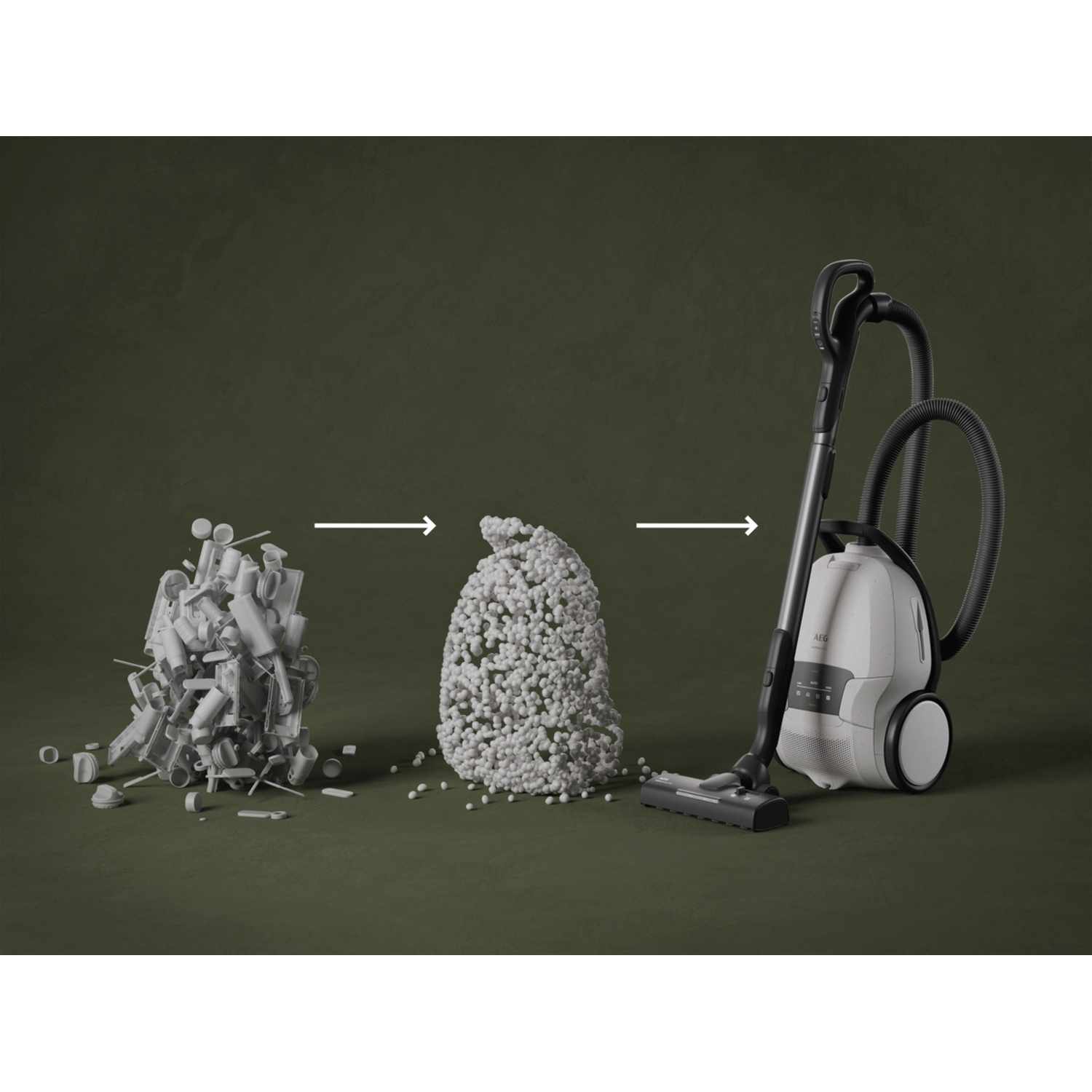 A vacuum cleaner sucks up a pile of granules formed from broken plastic parts.