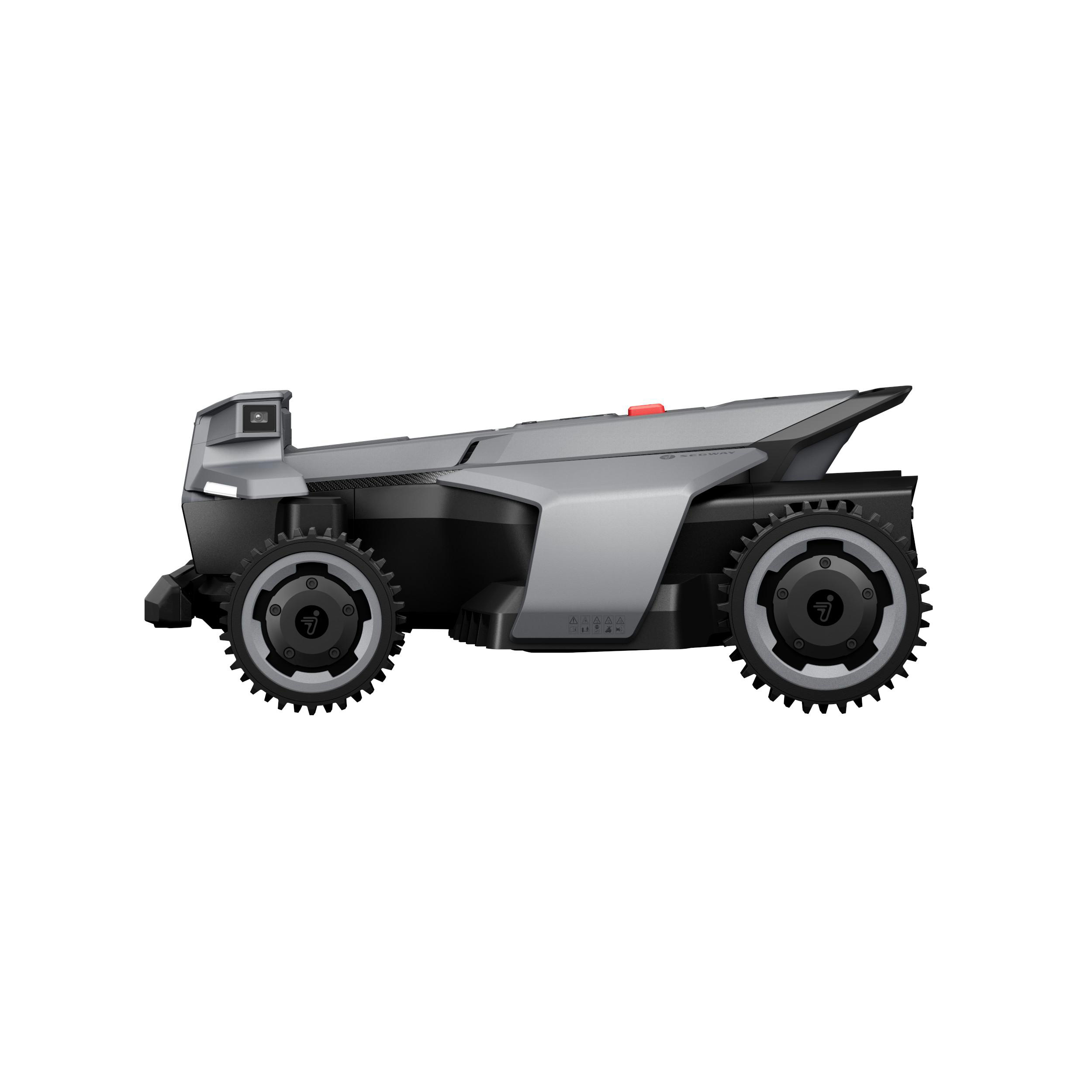 Ein grauer Mähroboter mit schwarzen Rädern und einer Kamera vorne.