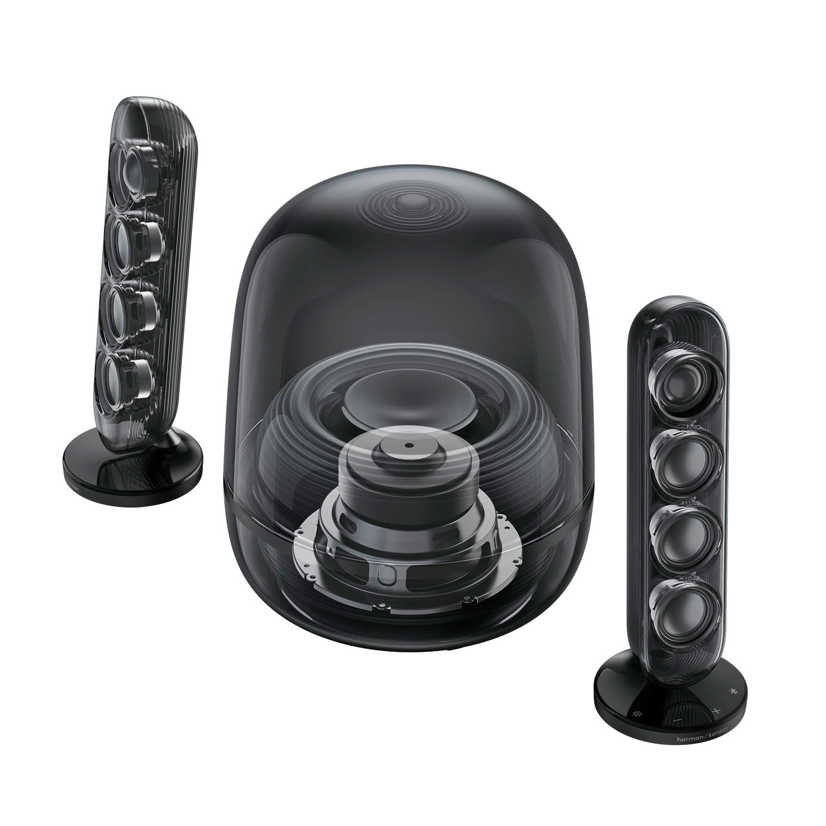 Transparente schwarze Lautsprecher mit sichtbaren Treibern und einem zentralen Subwoofer.