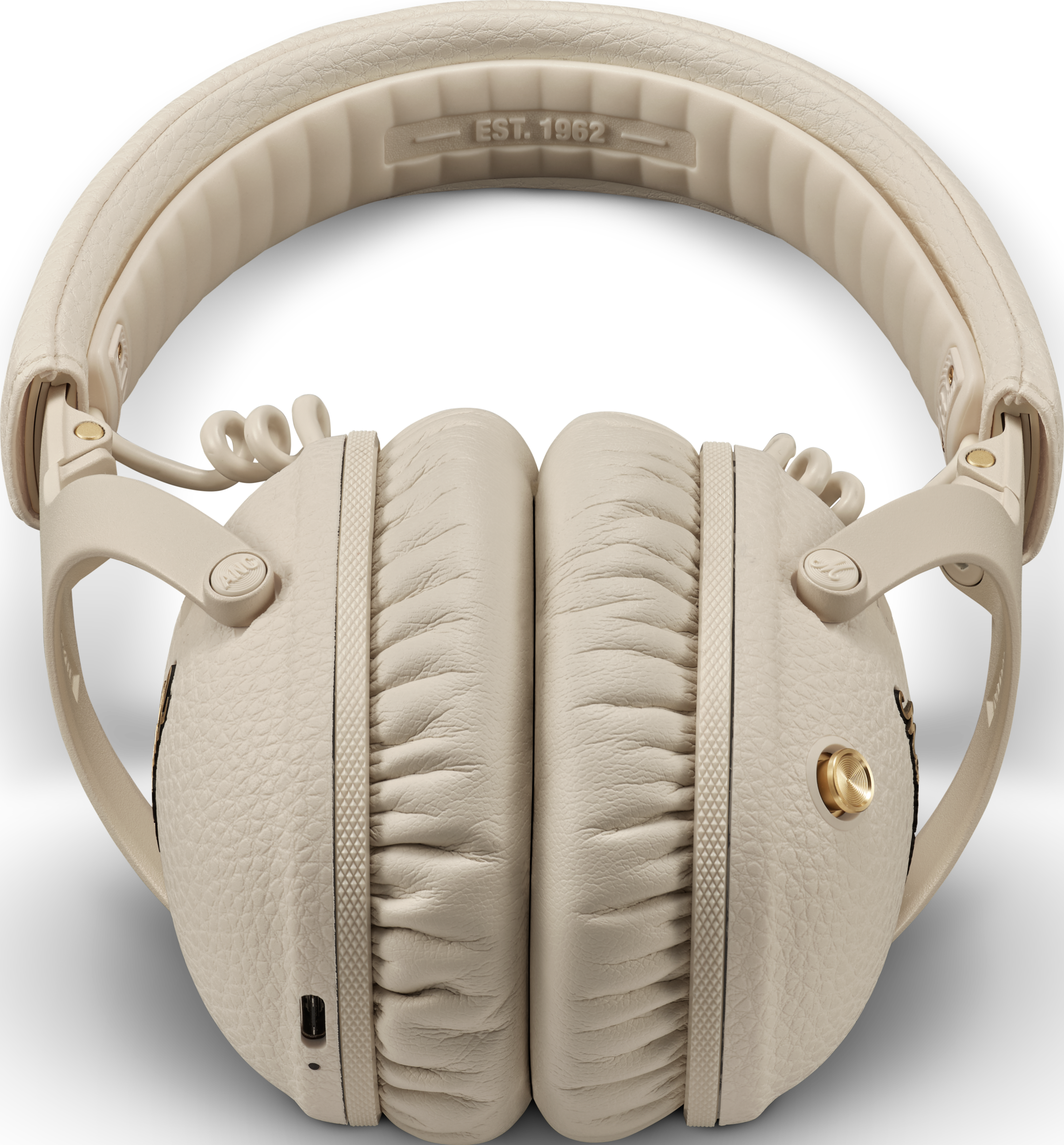 Cuffie color crema con texture in pelle e cavo a spirale.